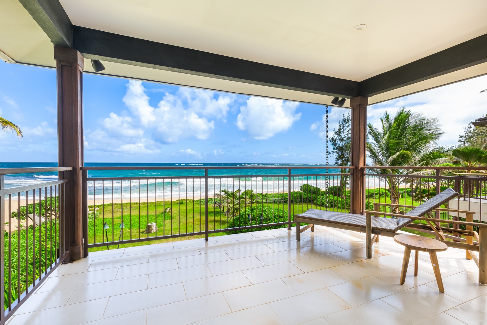 Laie Vacation Rentals, Majestic Mahakea Oceanfront Oasis - Enjoy the shaded outdoor lanai with comfortable seating and panoramic ocean views.