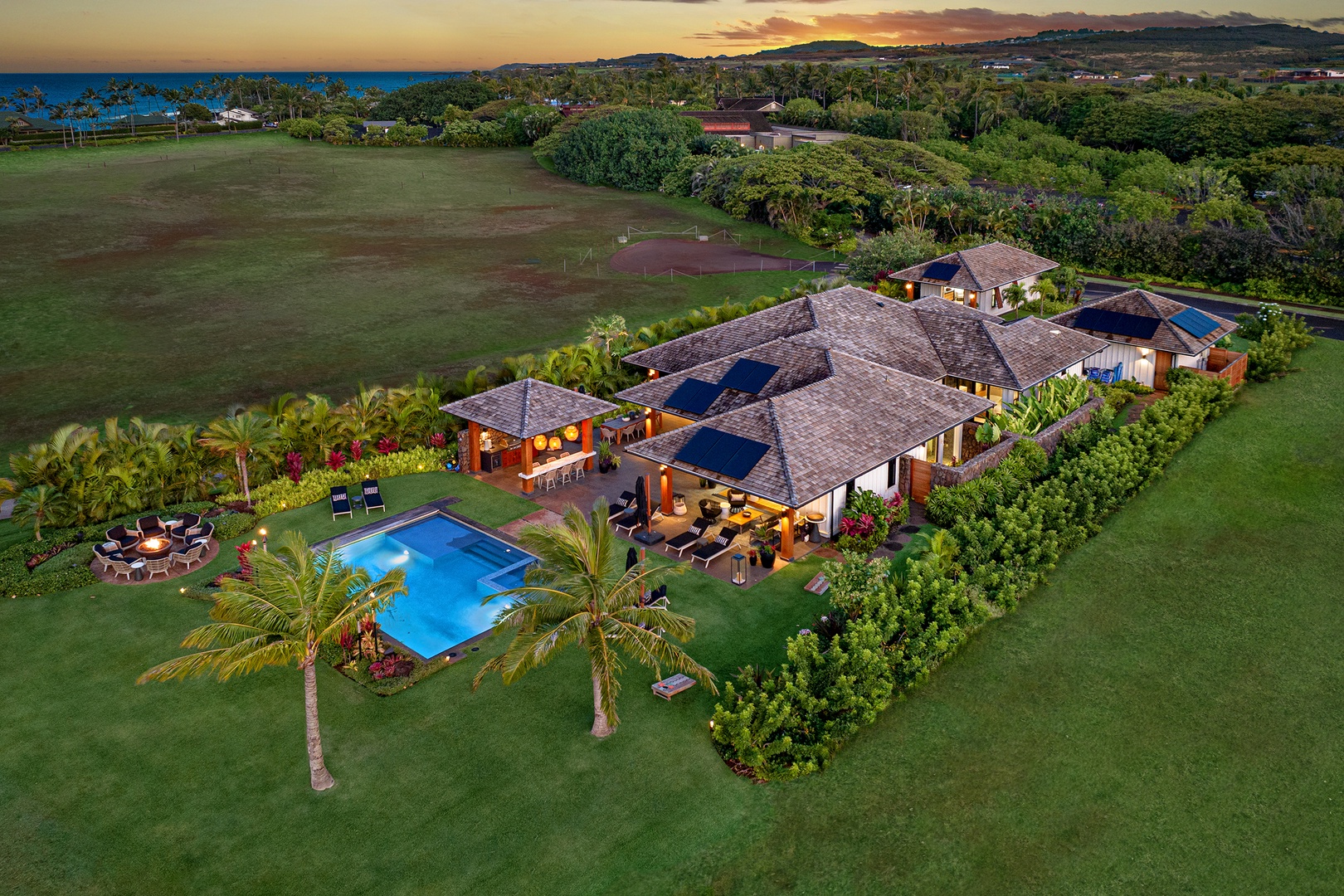 Koloa Vacation Rentals, Hale Pakika at Kukui'ula - Spacious estate with private pool and sunset views, surrounded by lush island greenery.