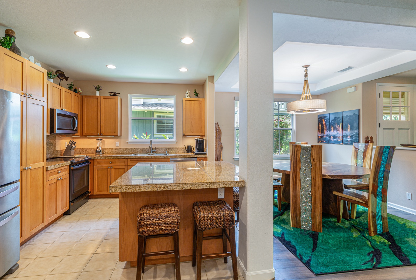 Princeville Vacation Rentals, Pualani Villa - The kitchen island provides additional counter space and seating for four.