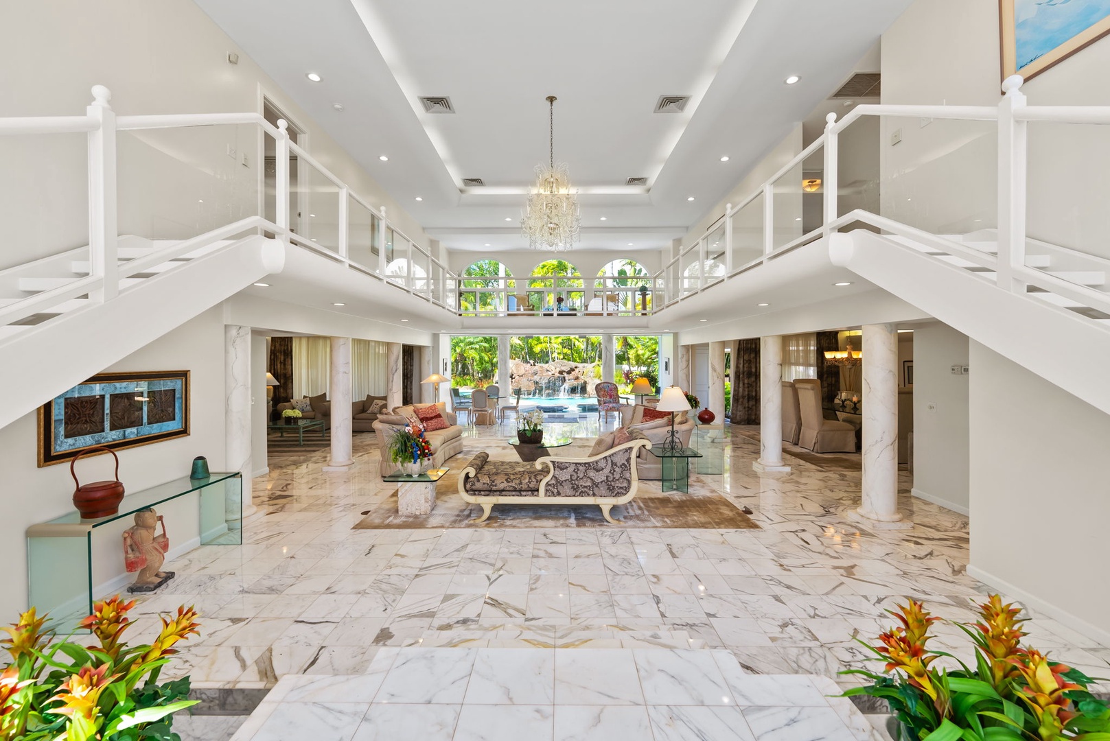 Honolulu Vacation Rentals, Kahala Oasis - Stunning grand entrance lobby with high ceilings, marble floors, and elegant decor for a luxurious first impression.