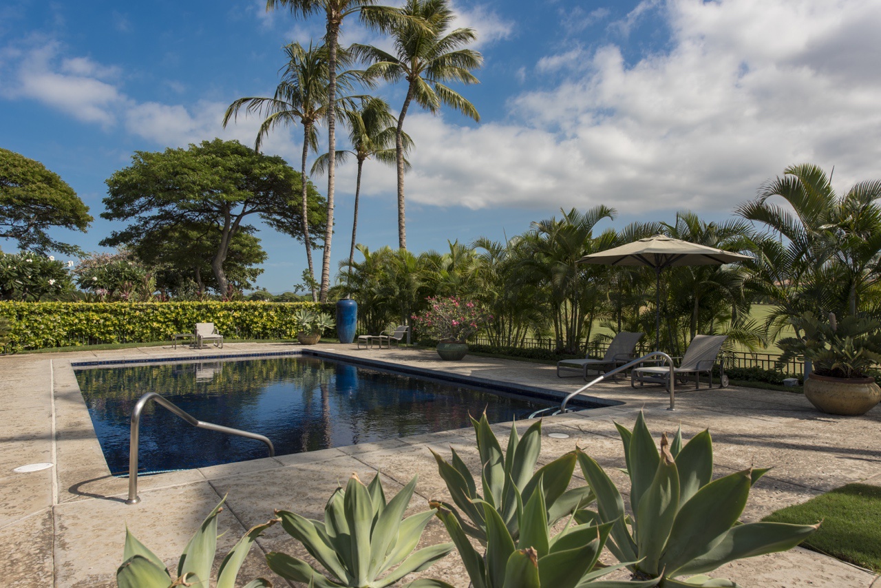 Kailua Kona Vacation Rentals, 2BD Hillside Villa (4102) at Hualalai Resort - Relaxing by the resort's pool with loungers and tropical views!