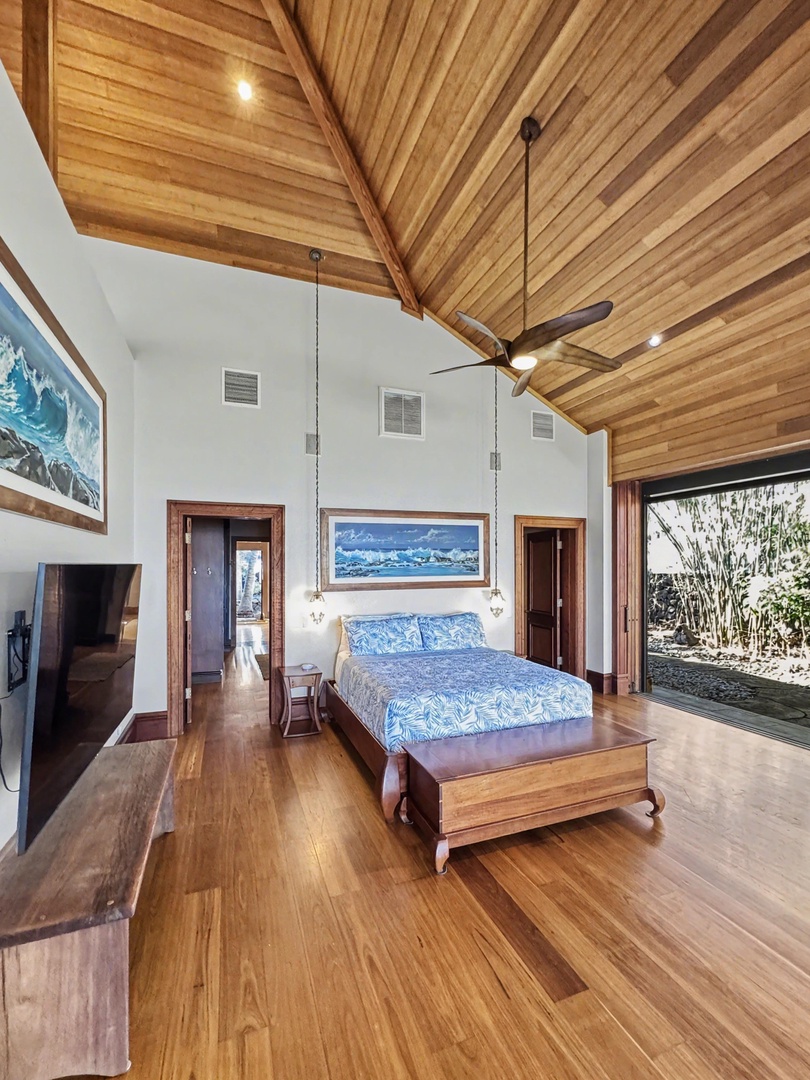 Kailua-Kona Vacation Rentals, Hahalua Bay Villa - Drift off beneath soaring wood ceilings in this tropical master suite, where ocean-inspired art and warm hardwood create your perfect sanctuary.