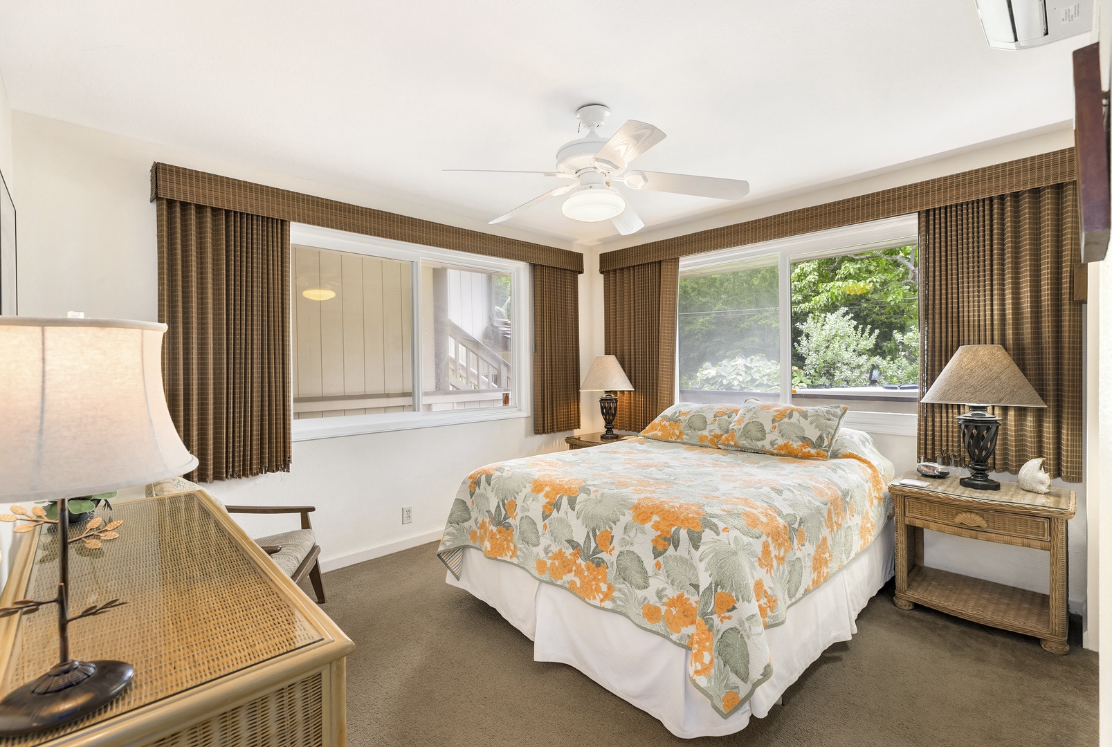 Haleiwa Vacation Rentals, Hale Kimo - Guest bedroom with large windows for a bright and cozy retreat.