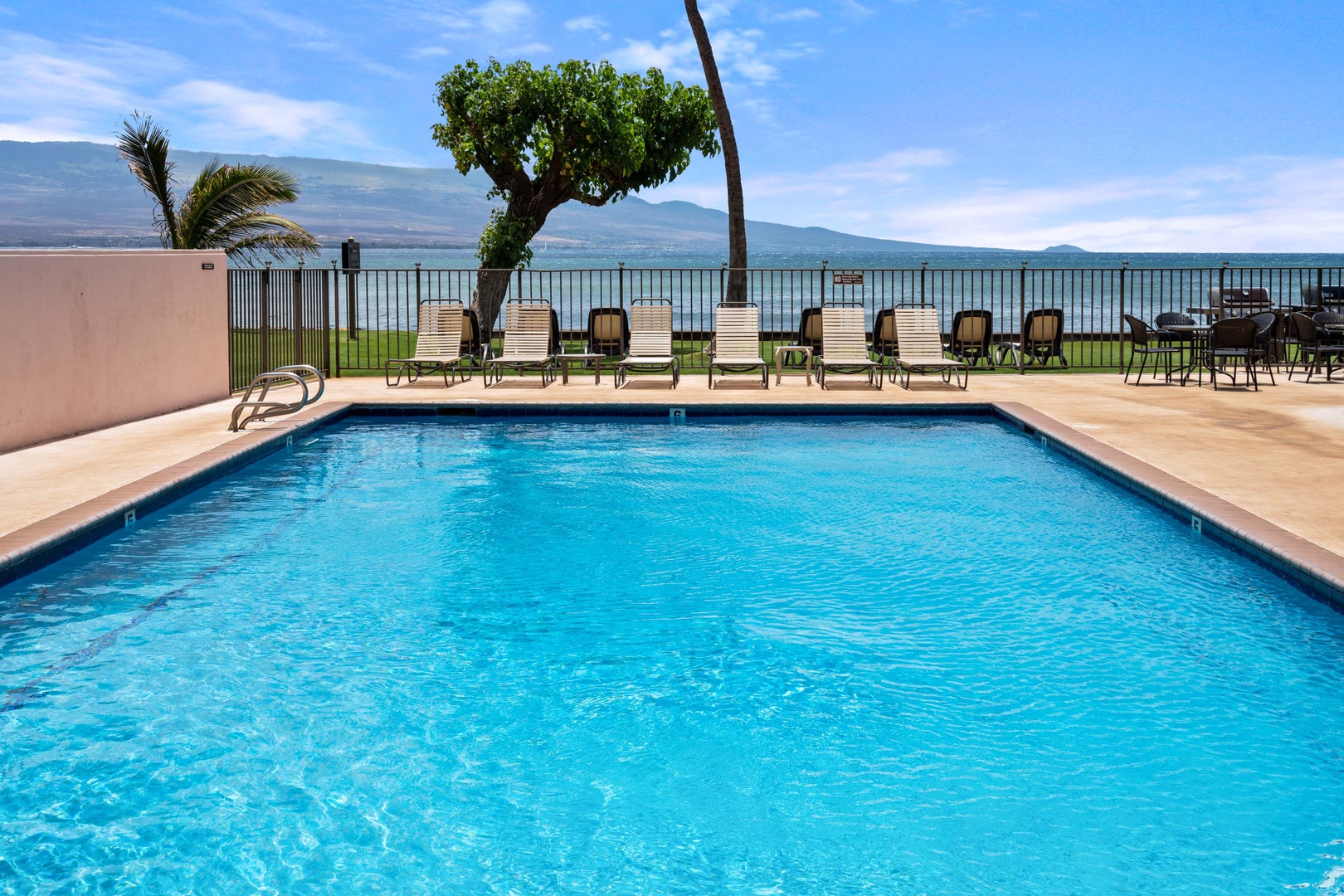 Wailuku Vacation Rentals, Milowai 310 - Look past the pool fence and the mountains across the channel are still part of the view.