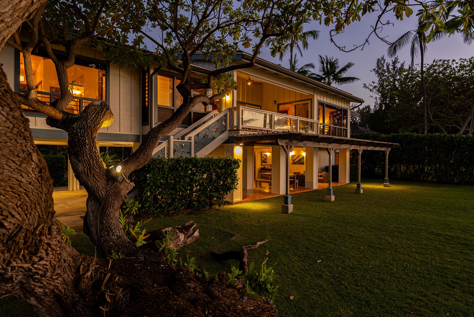 Haleiwa Vacation Rentals, Maluhia Beach House - Golden hour brings a warm glow to this luxurious oceanfront estate.