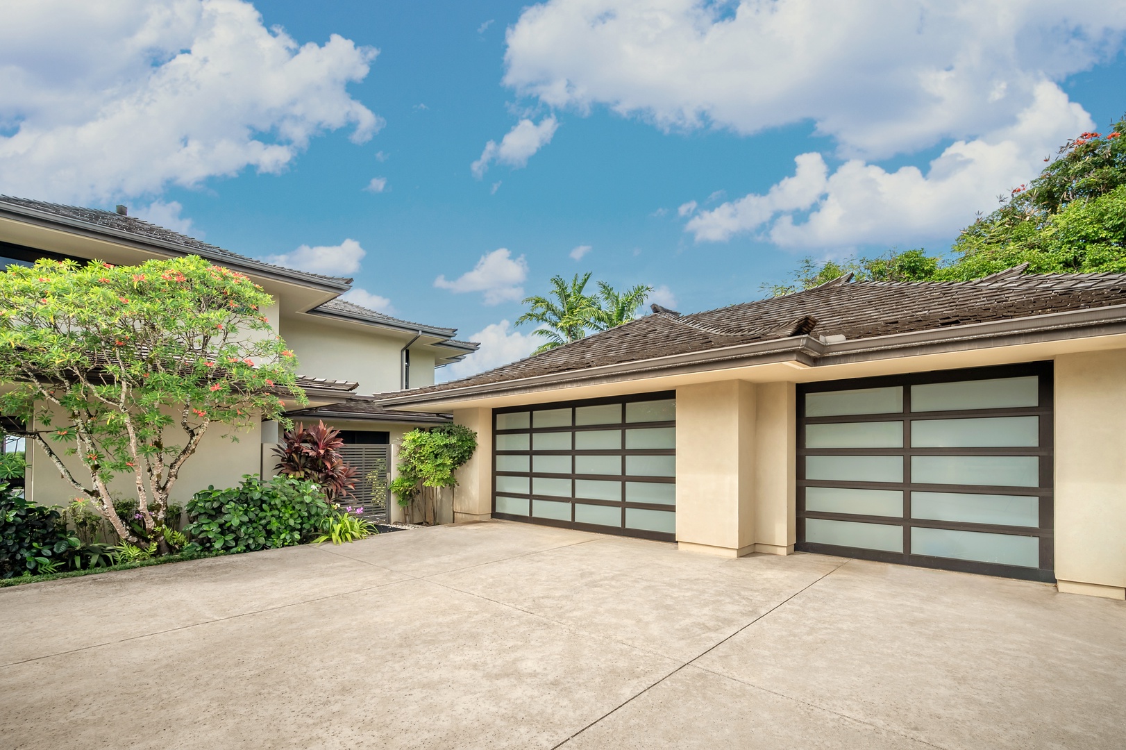 Princeville Vacation Rentals, Hanalei Plantation Villa - Modern villa exterior with sleek architecture and tropical landscaping.