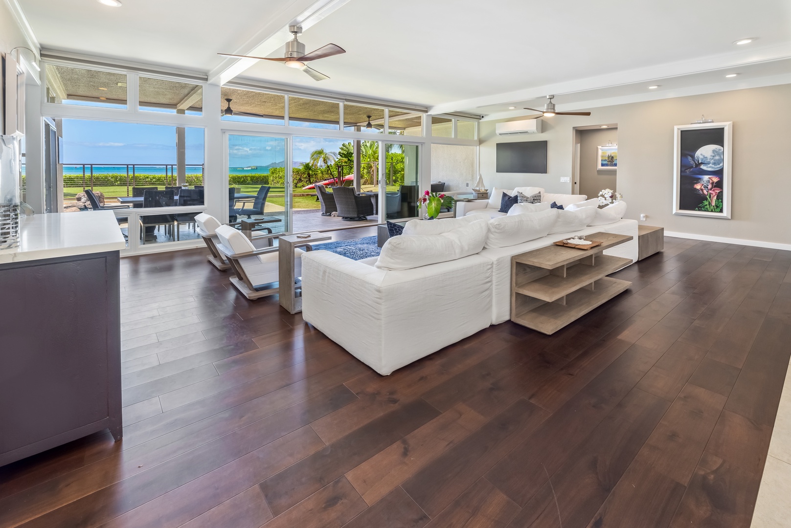 Honolulu Vacation Rentals, Nanea Kai Villa - Spacious open-concept living room with ocean views and seamless indoor-outdoor flow.