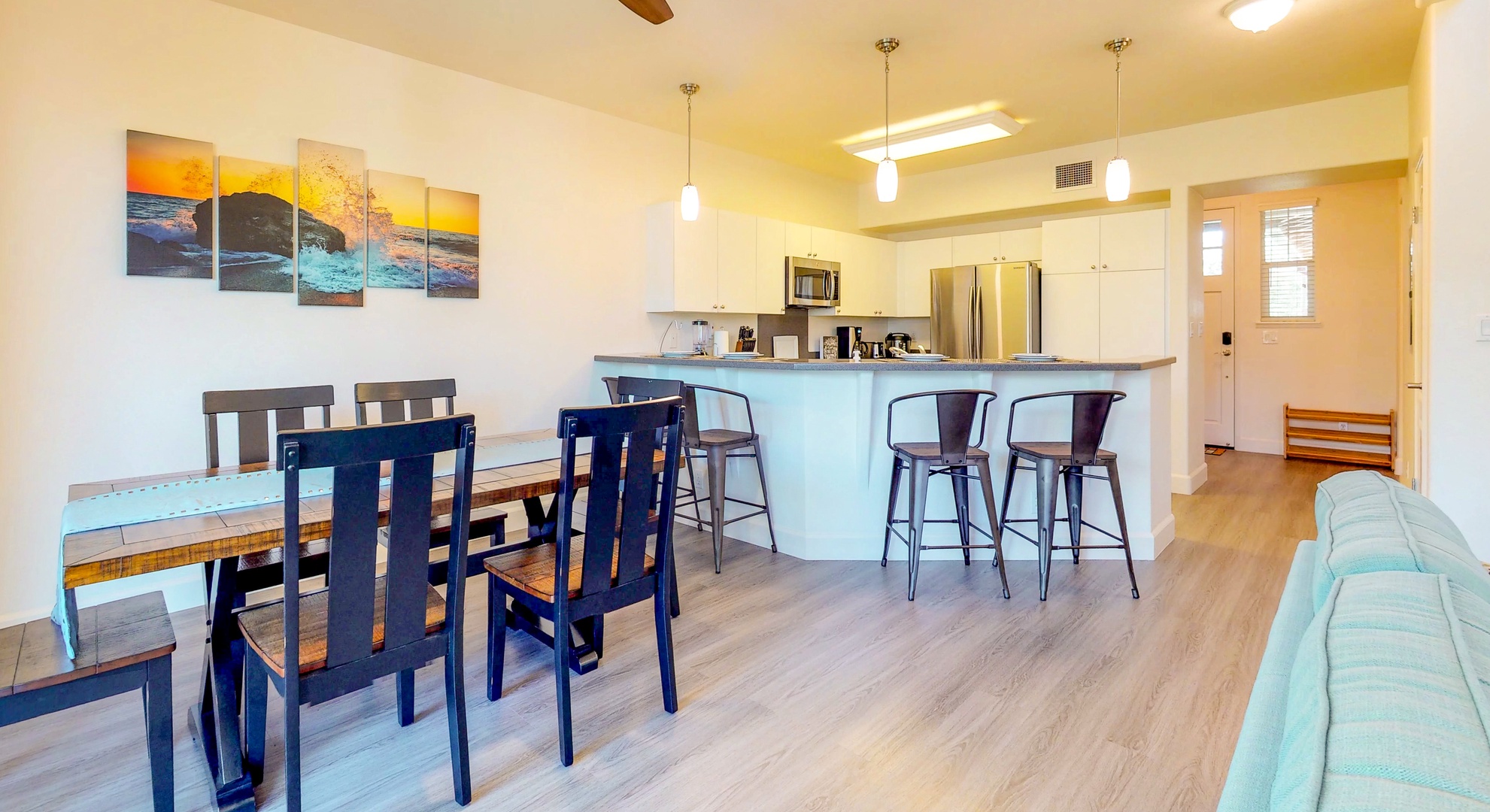 Kapolei Vacation Rentals, Ko Olina Kai 1051D - The breakfast bar opens up to the dining and living room area.