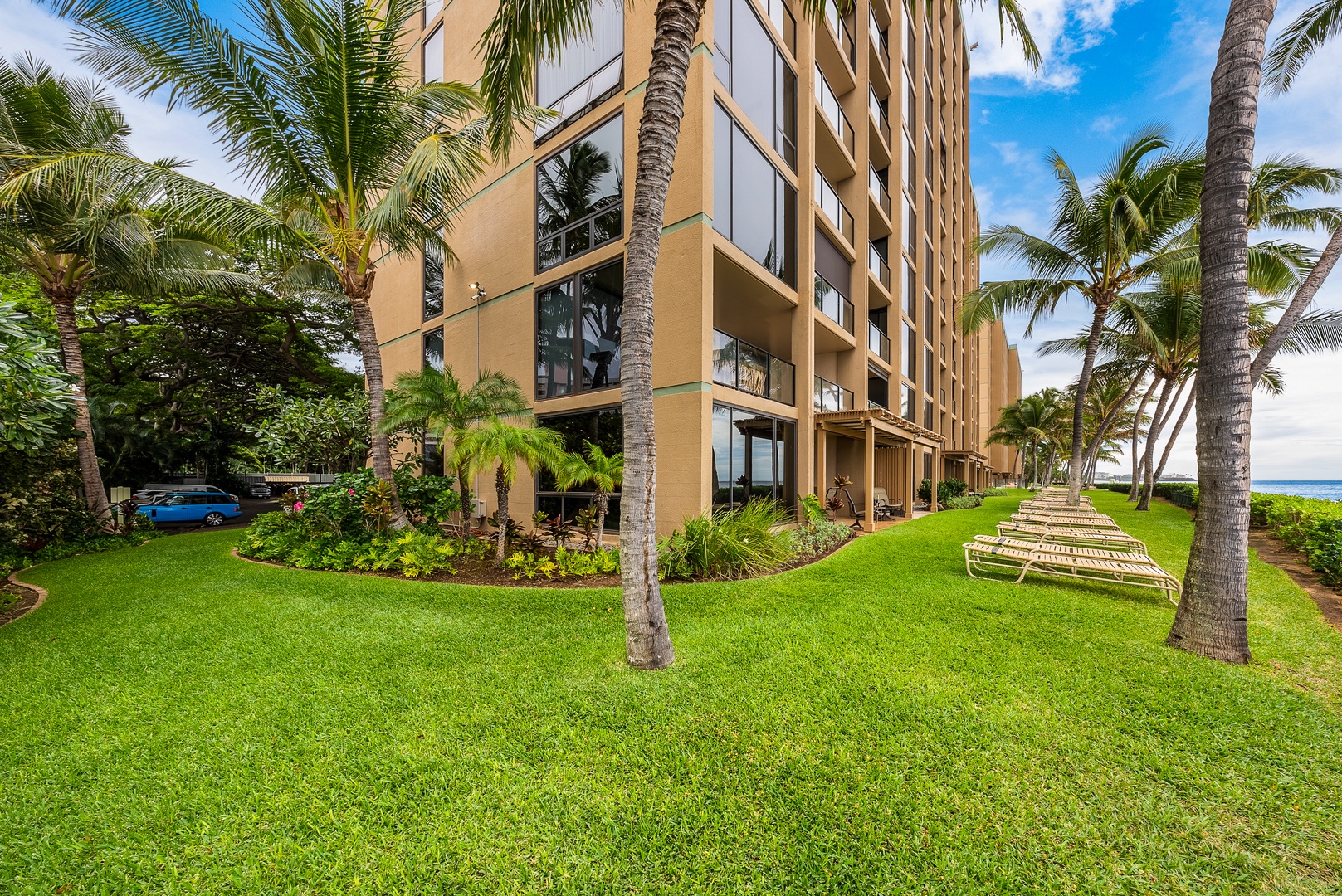 Lahaina Vacation Rentals, Mahana 1119 - Relax in a lounge chair on the lawn at Mahana 1119 where the waves are just steps away.