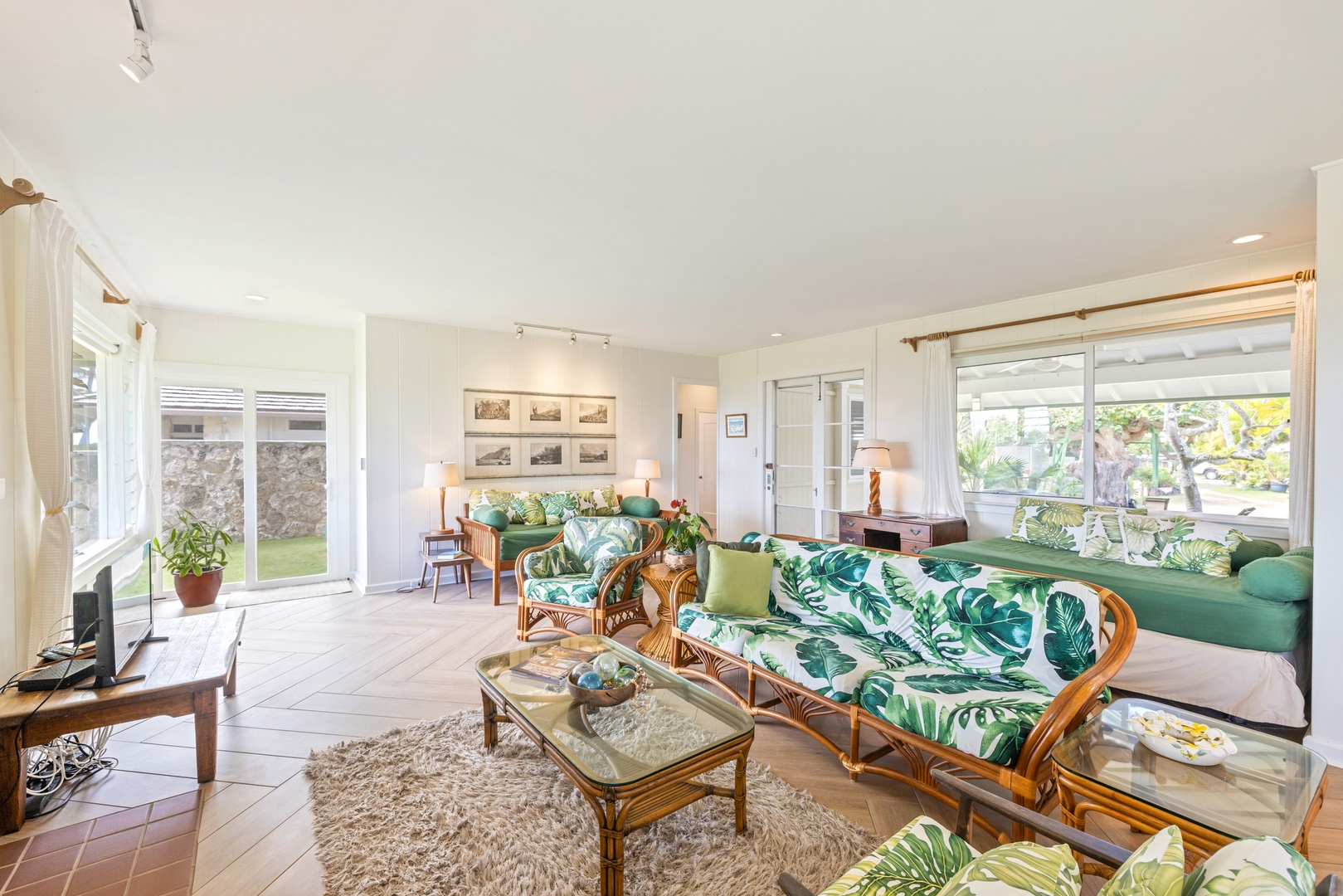 Kailua Vacation Rentals, Hale Moana Lanikai - The room features tropical-inspired sofas that add a touch of island charm, complementing the sleek, modern backdrop