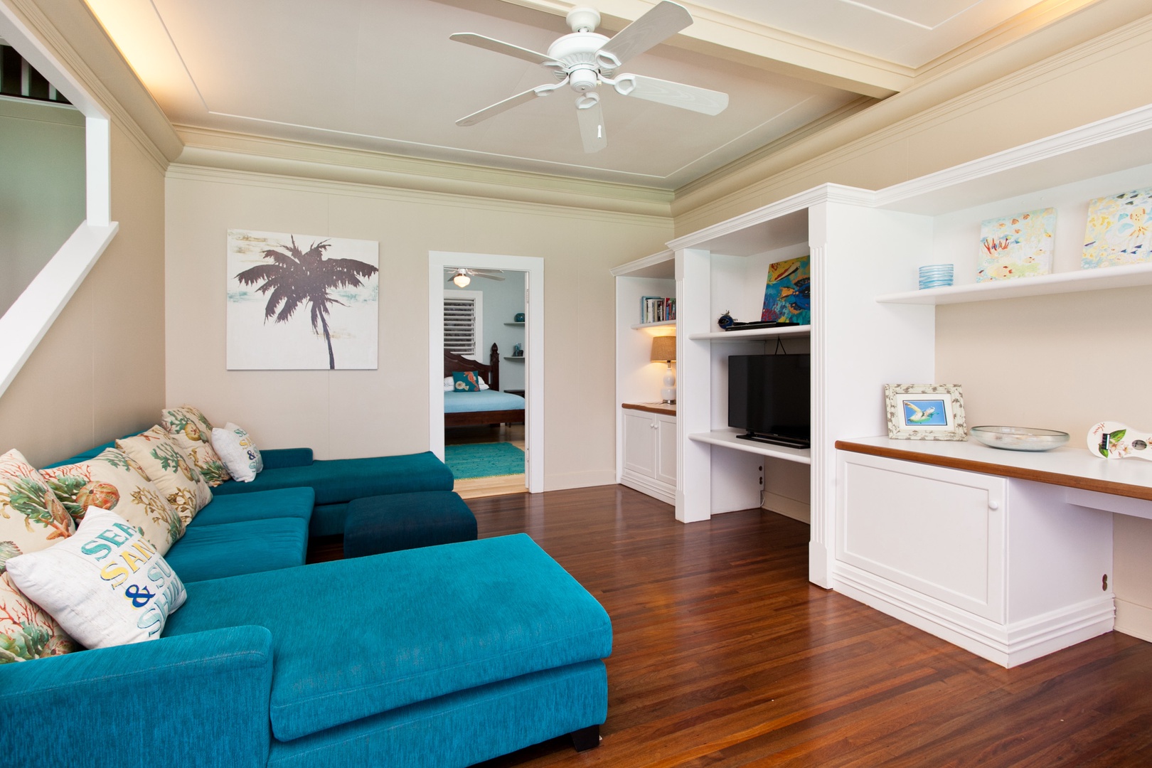 Kailua Vacation Rentals, Hale Mahina Lanikai* - Adorned with a plush sectional blue couch and a smart TV.