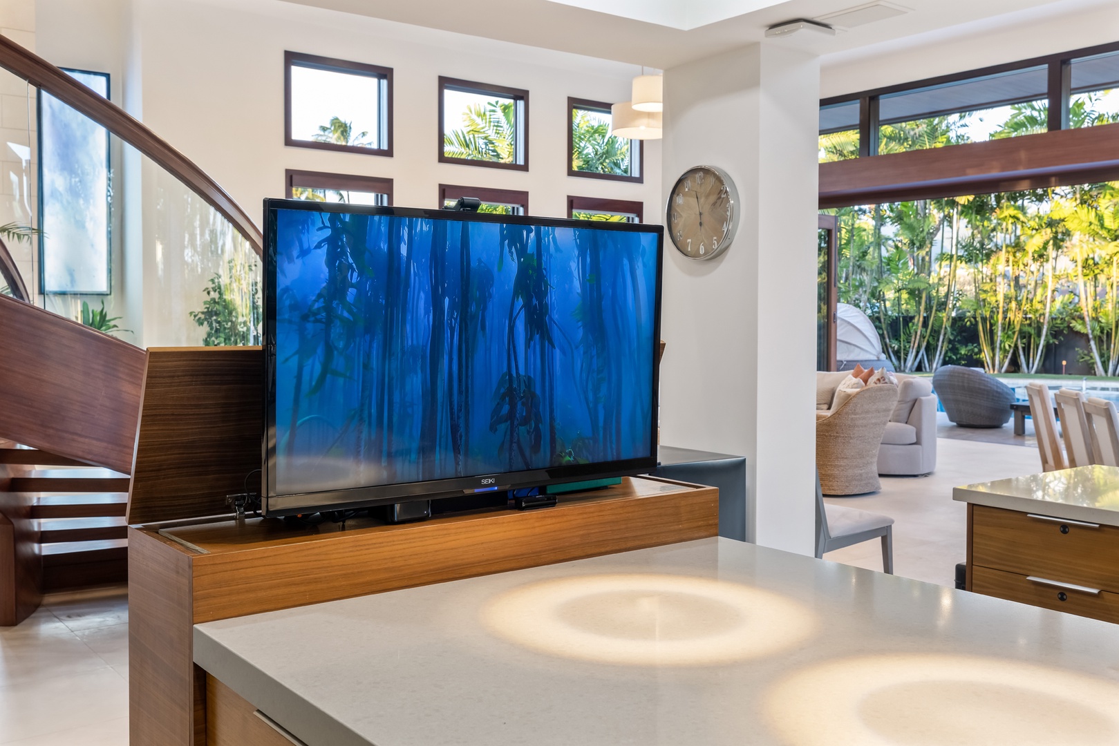 Honolulu Vacation Rentals, Kahala Grand Splendor - Hidden pop-up TV on the kitchen island for entertainment at the touch of a button.