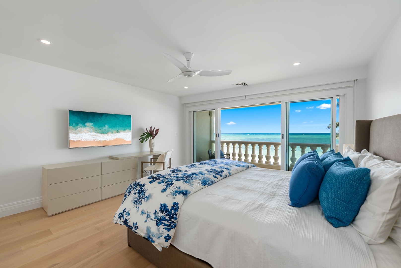 Kailua Vacation Rentals, Lanikai Sunrise Estate - Second guest suite with balcony access, beachy blues, and natural light—perfect for restful nights.