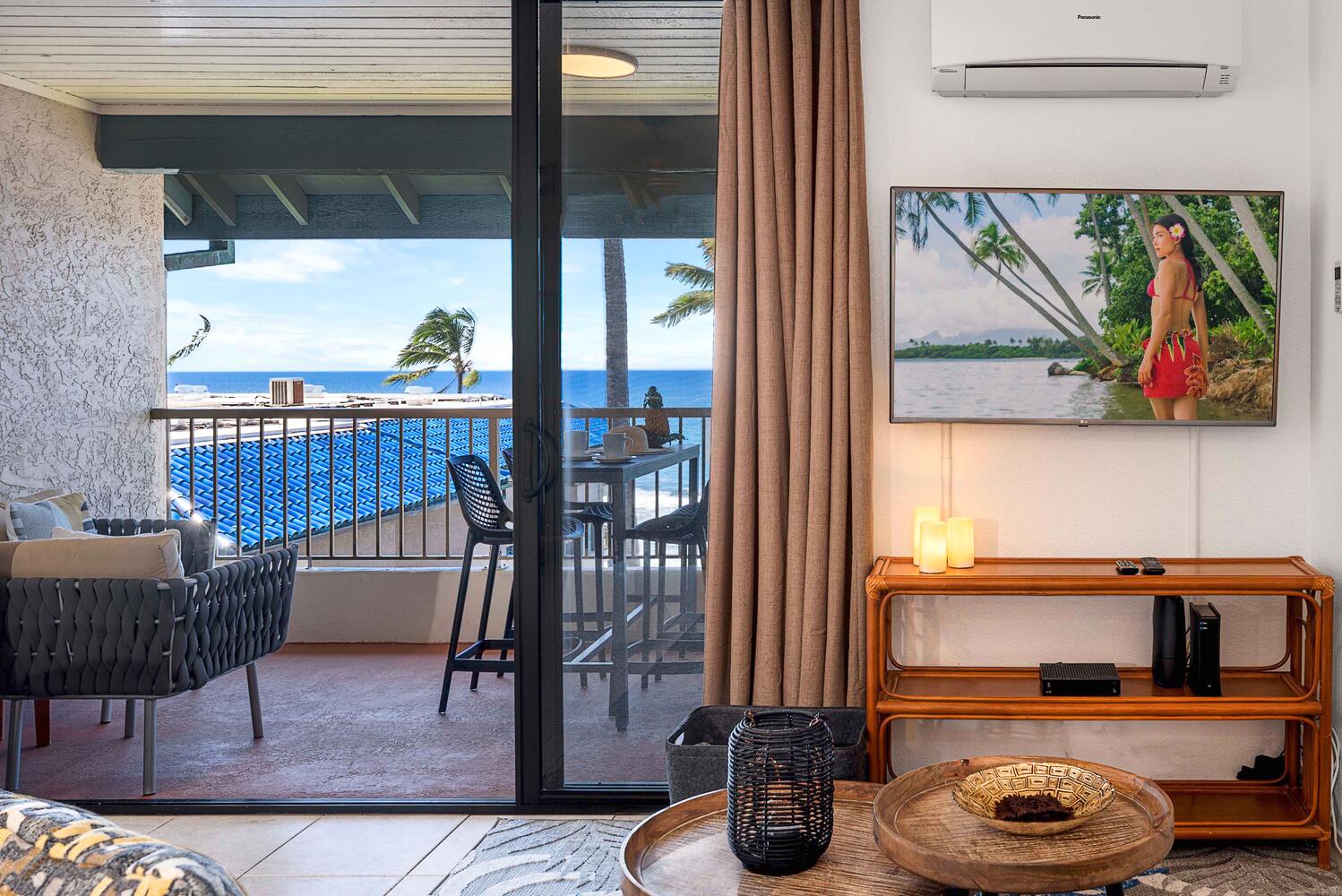 Kailua Kona Vacation Rentals, Kona Reef F23 - Cozy corner with easy access to the balcony for indoor-outdoor living by the sea.