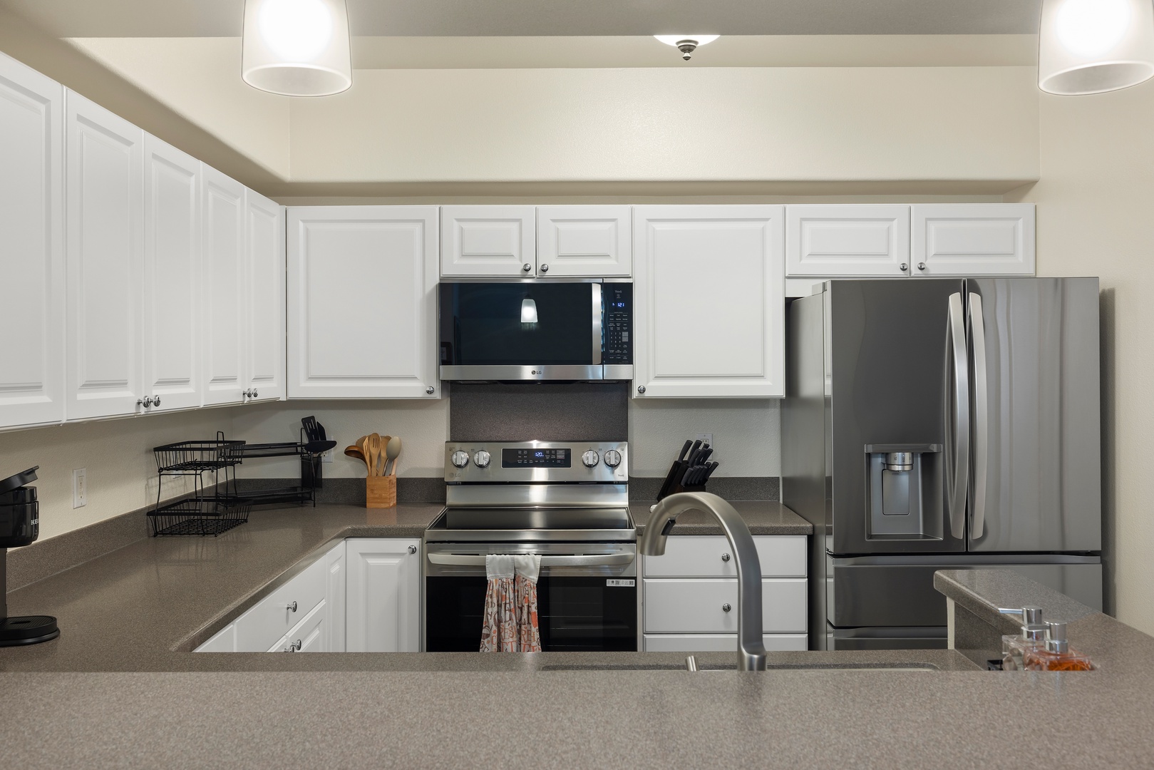 Kapolei Vacation Rentals, Ko Olina Kai 1061F - Cook your favorite meals in this bright, fully-equipped kitchen with stainless steel appliances and ample counter space for all your culinary adventures.