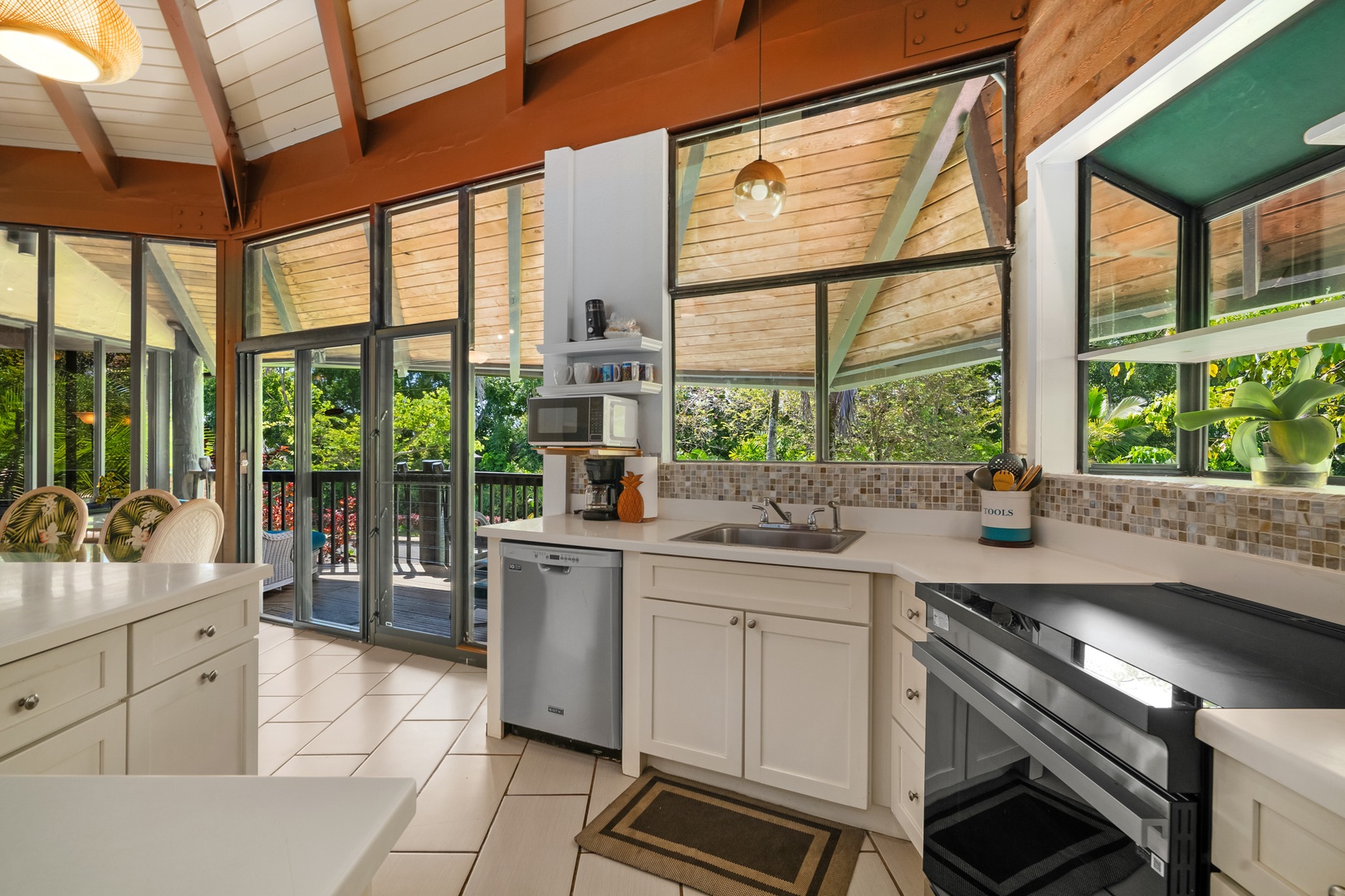 Princeville Vacation Rentals, Mauna Kai 7B - Dinner prep comes easy with the garden filling the window in front of you.