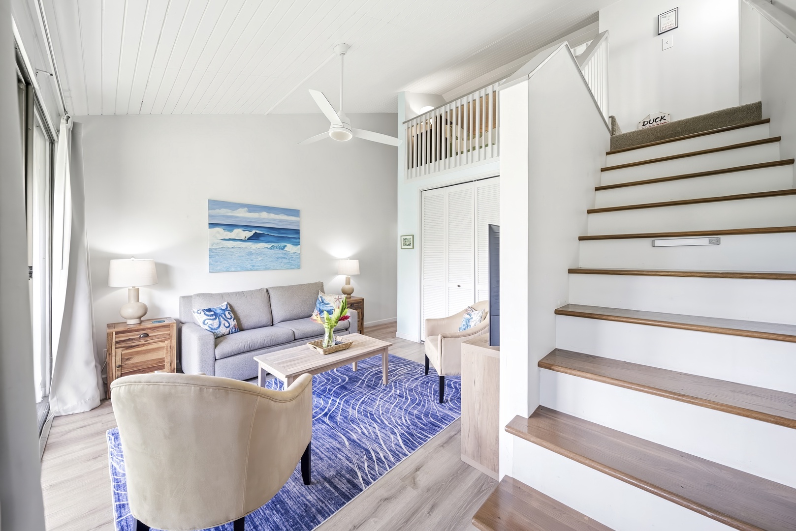 Kahuku Vacation Rentals, Kuilima Estates West #132 - Stairs climb from the living area up to the lofted sleeping space above.