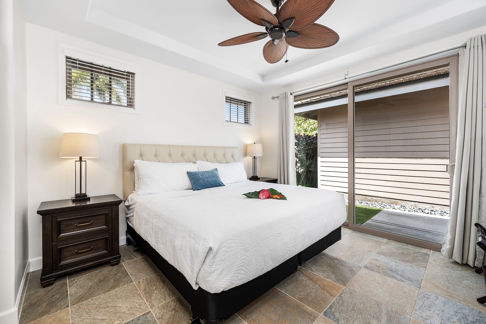 Kailua Kona Vacation Rentals, Holua Moana Hale - Relax in the downstairs bedroom with a king bed, AC, TV, and direct lanai access.