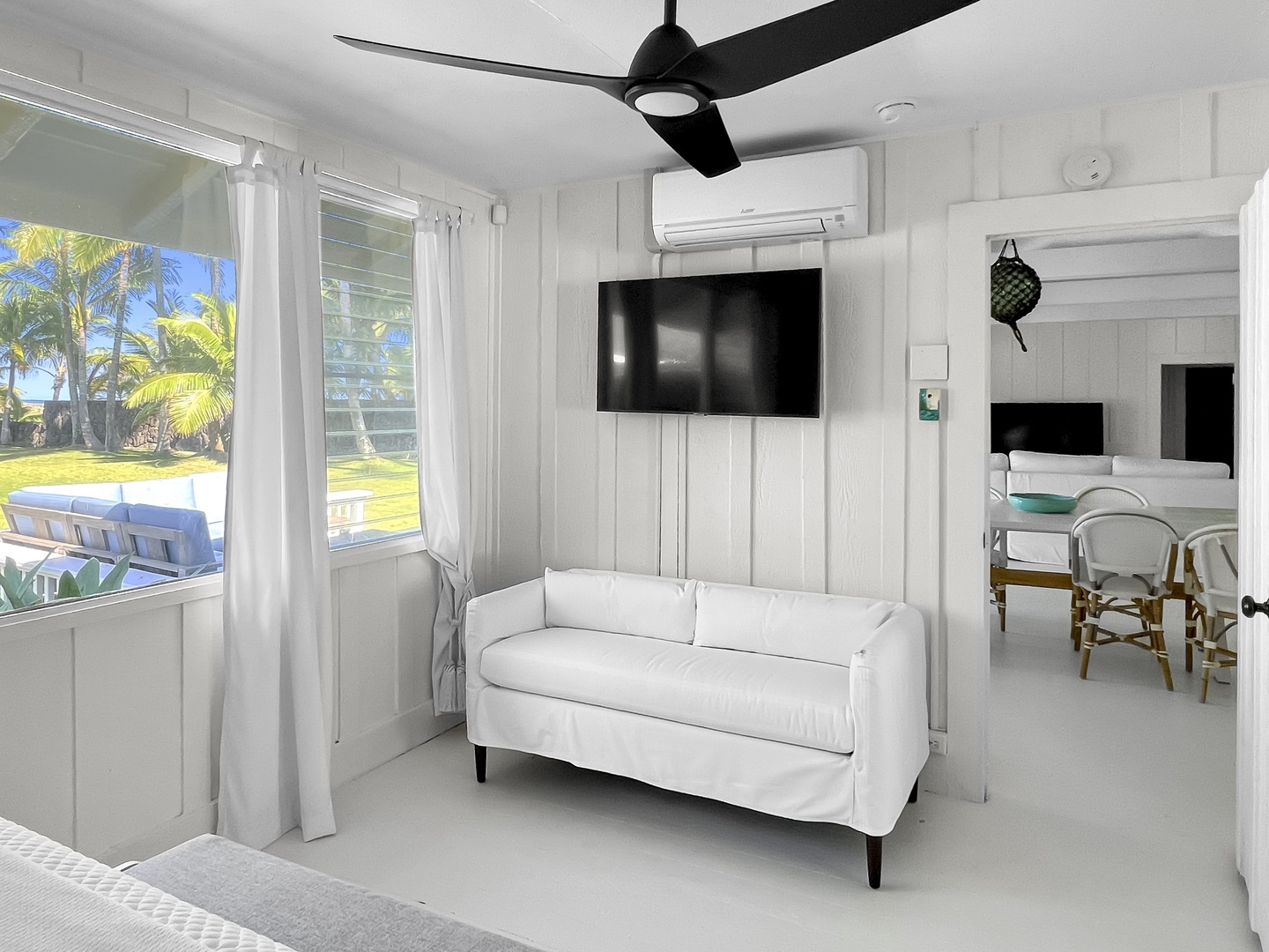 Kailua Vacation Rentals, Kai Mele - The Primary Bedroom comes with a cozy sitting area, tv and split AC