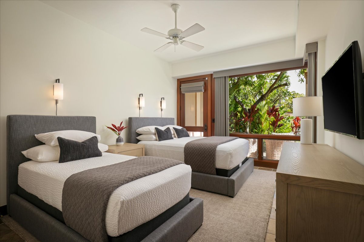 Kailua Kona Vacation Rentals, 2BD Fairways Villa (120C) at Four Seasons Resort at Hualalai - Second guest bedroom with 1 Queen and 1 Twin beds, wall mounted flatscreen television and patio.