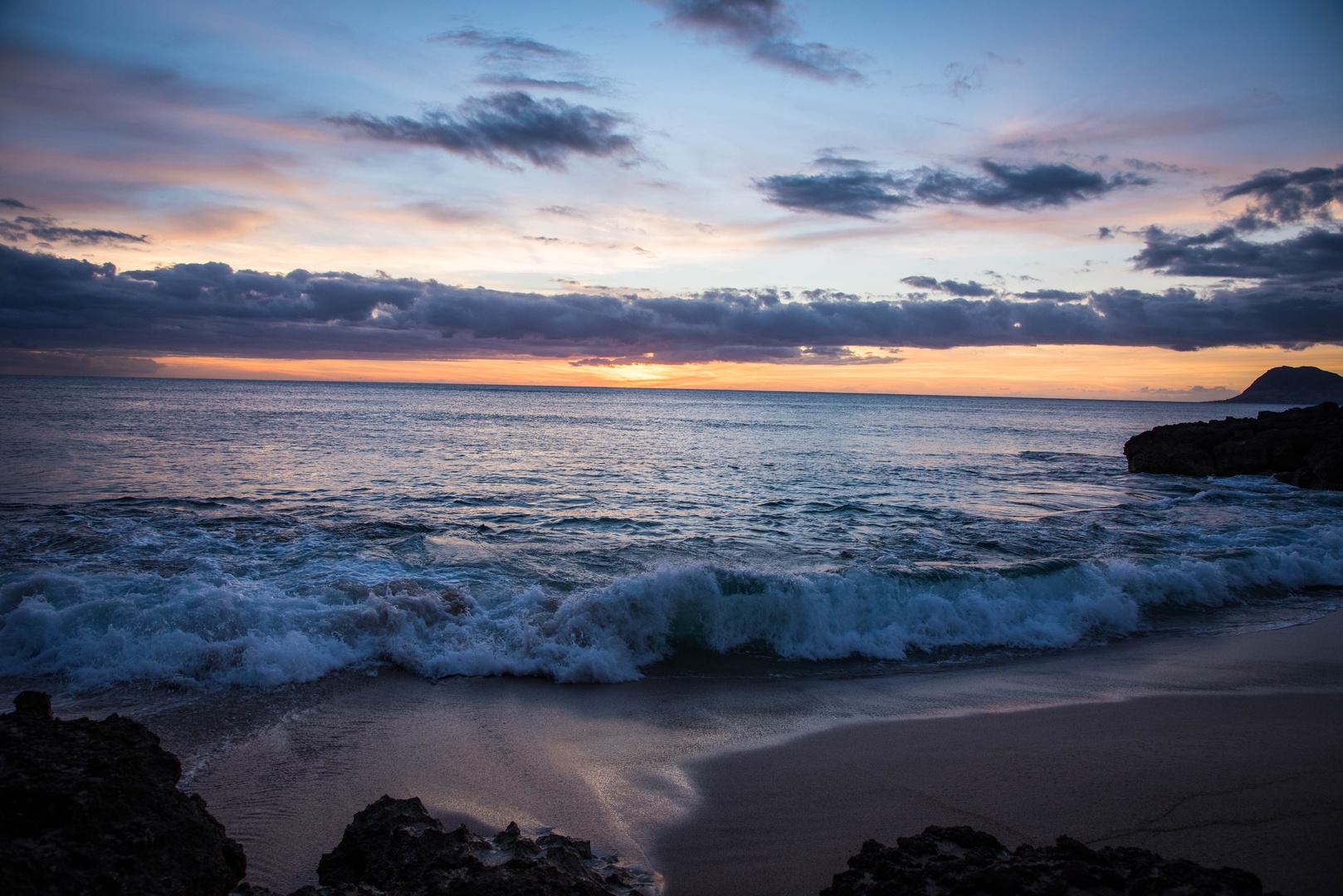 Kapolei Vacation Rentals, Ko Olina Kai 1065E - Picturesque skies over sand weathered rocks at the beach.