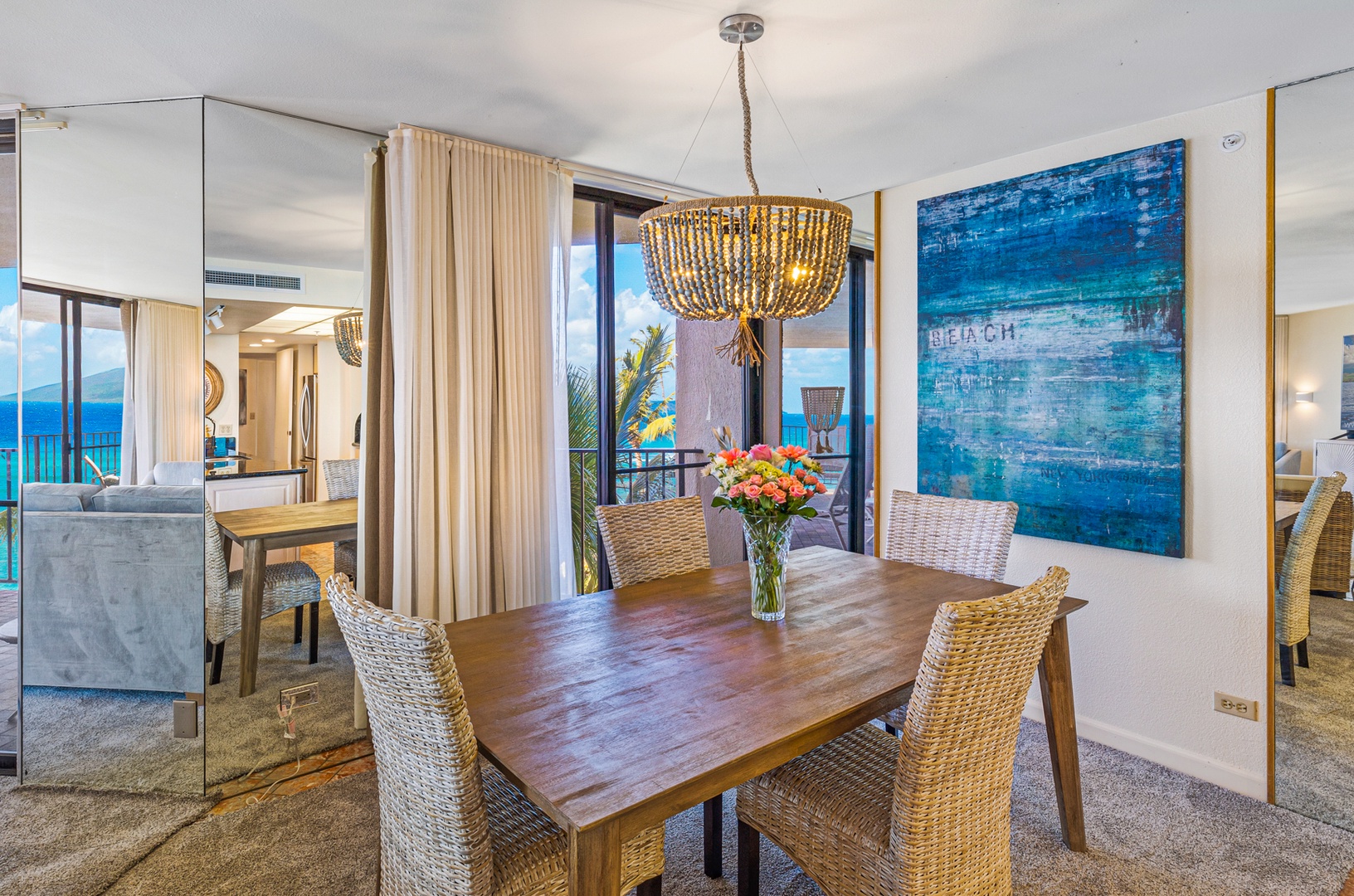 Lahaina Vacation Rentals, Kaanapali Shores 502 - The elegant dining space is beautifully illuminated, offering a warm and welcoming atmosphere for shared meals.