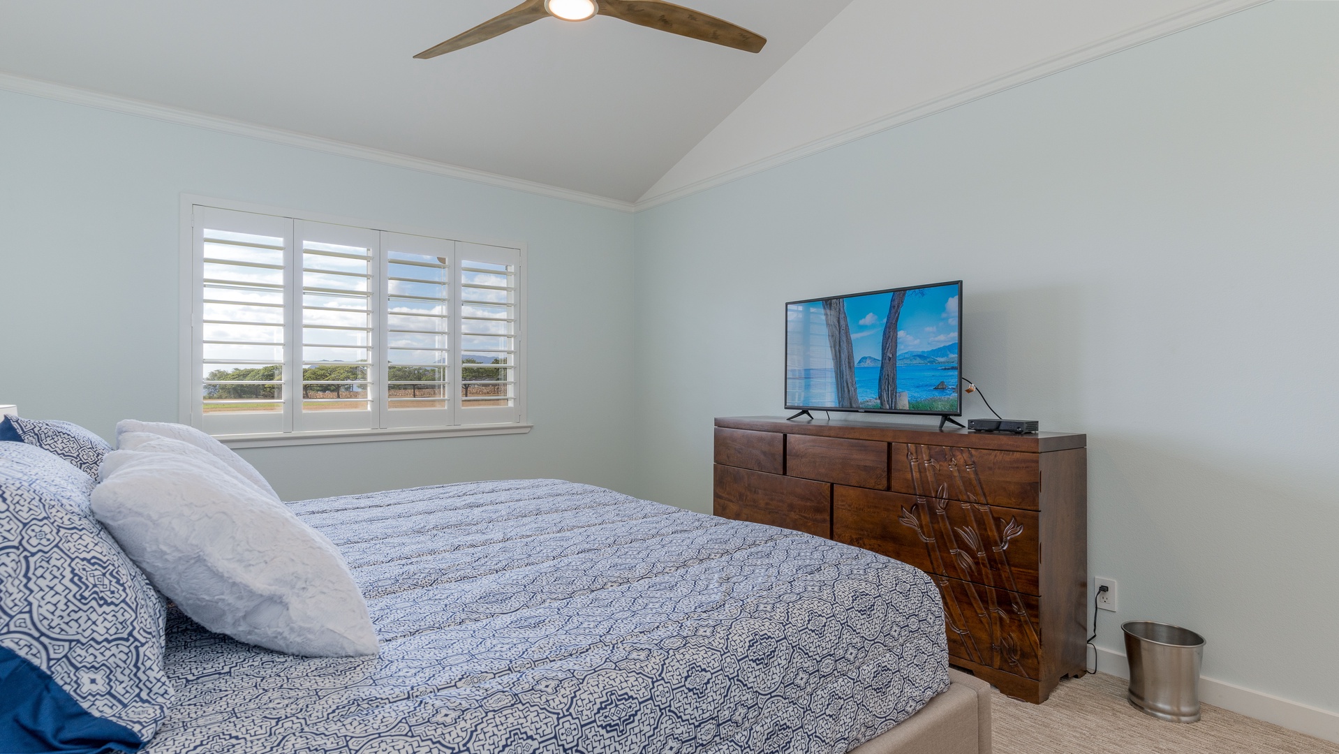 Kapolei Vacation Rentals, Kai Lani 21C - The primary guest bedroom includes a dresser and television.