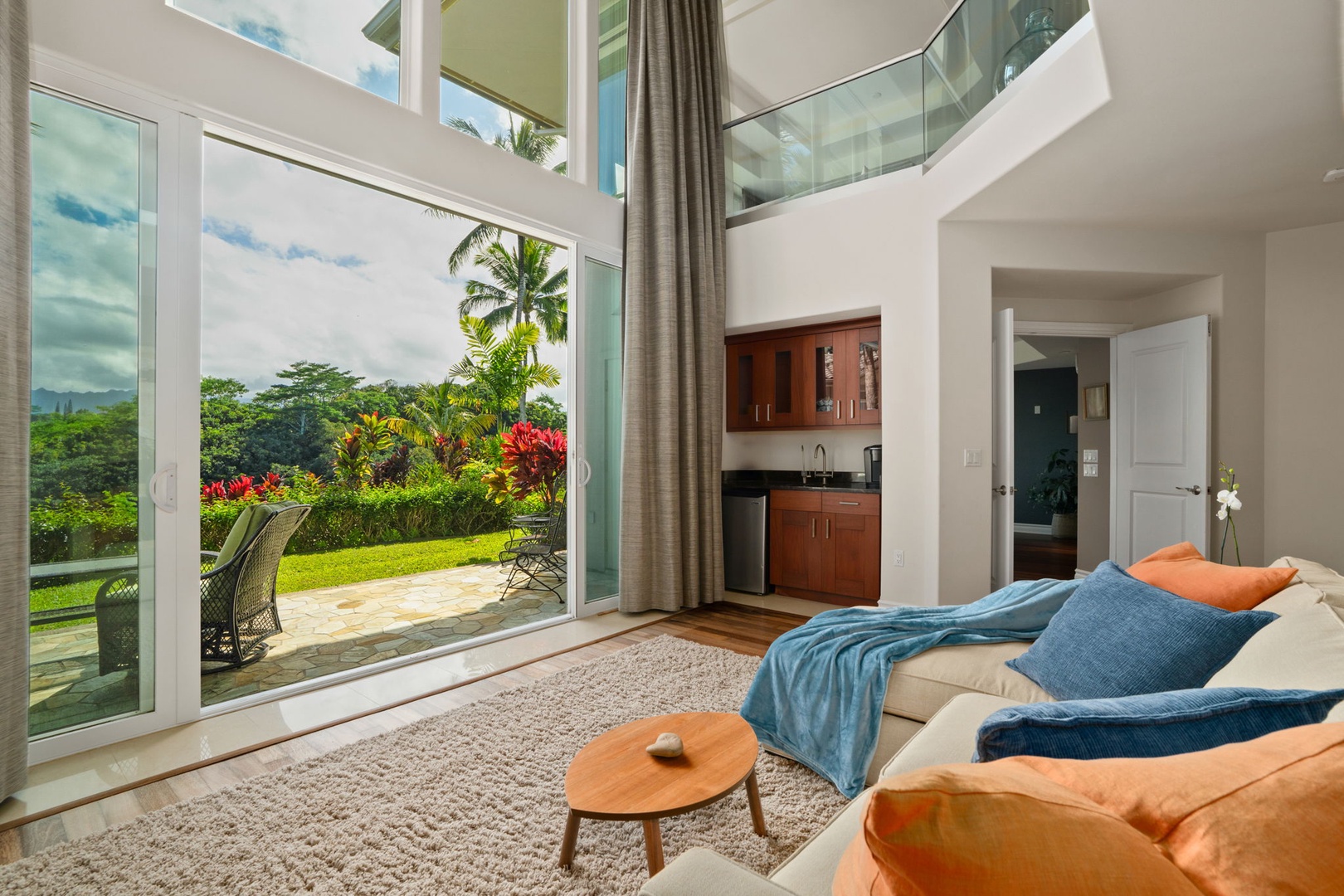 Princeville Vacation Rentals, Kaiulani #8 - Two stories of glass, so the lower lounge feels half garden before you open a door.