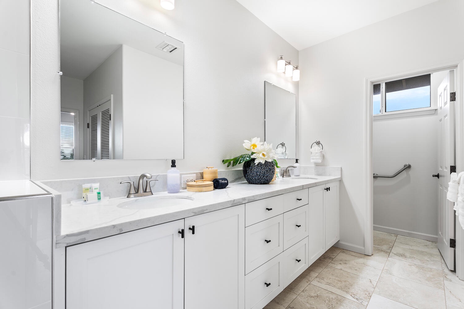 Kailua Kona Vacation Rentals, Kahakai Estates Hale - Ensuite bathroom for the primary suite with dual sink and wide vanity space.