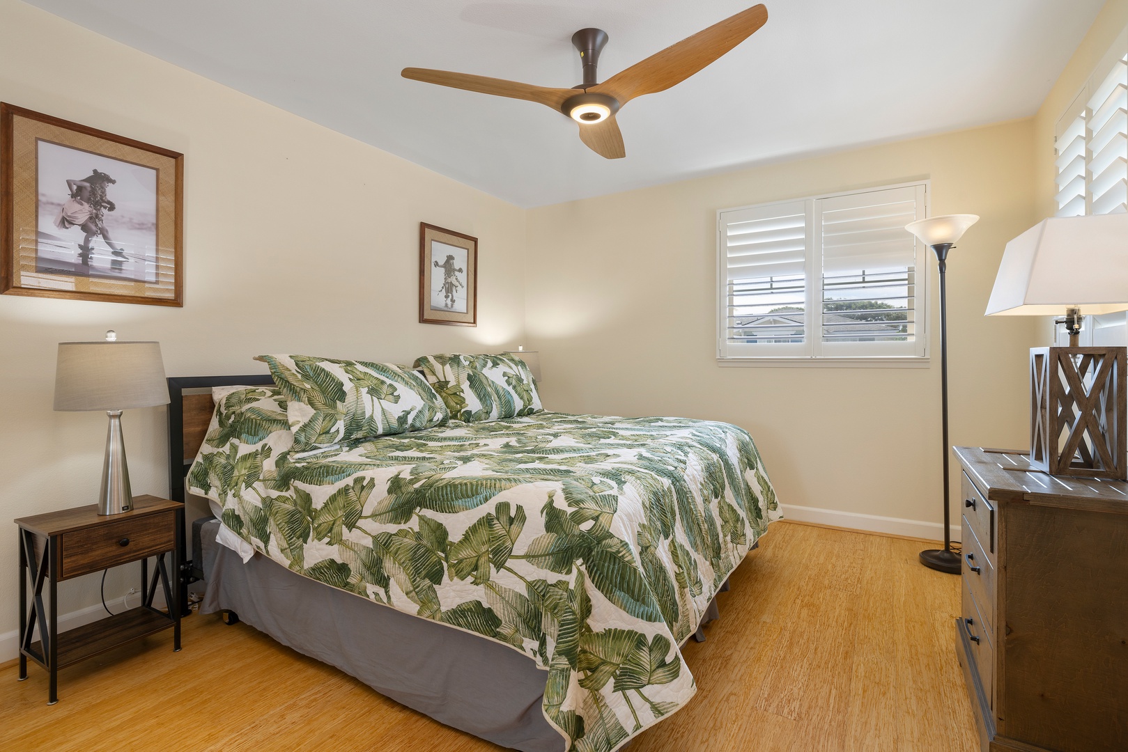 Kapolei Vacation Rentals, Ko Olina Kai 1083C - The upstairs guest bedroom featuring a large mirror, ceiling fan and framed art.