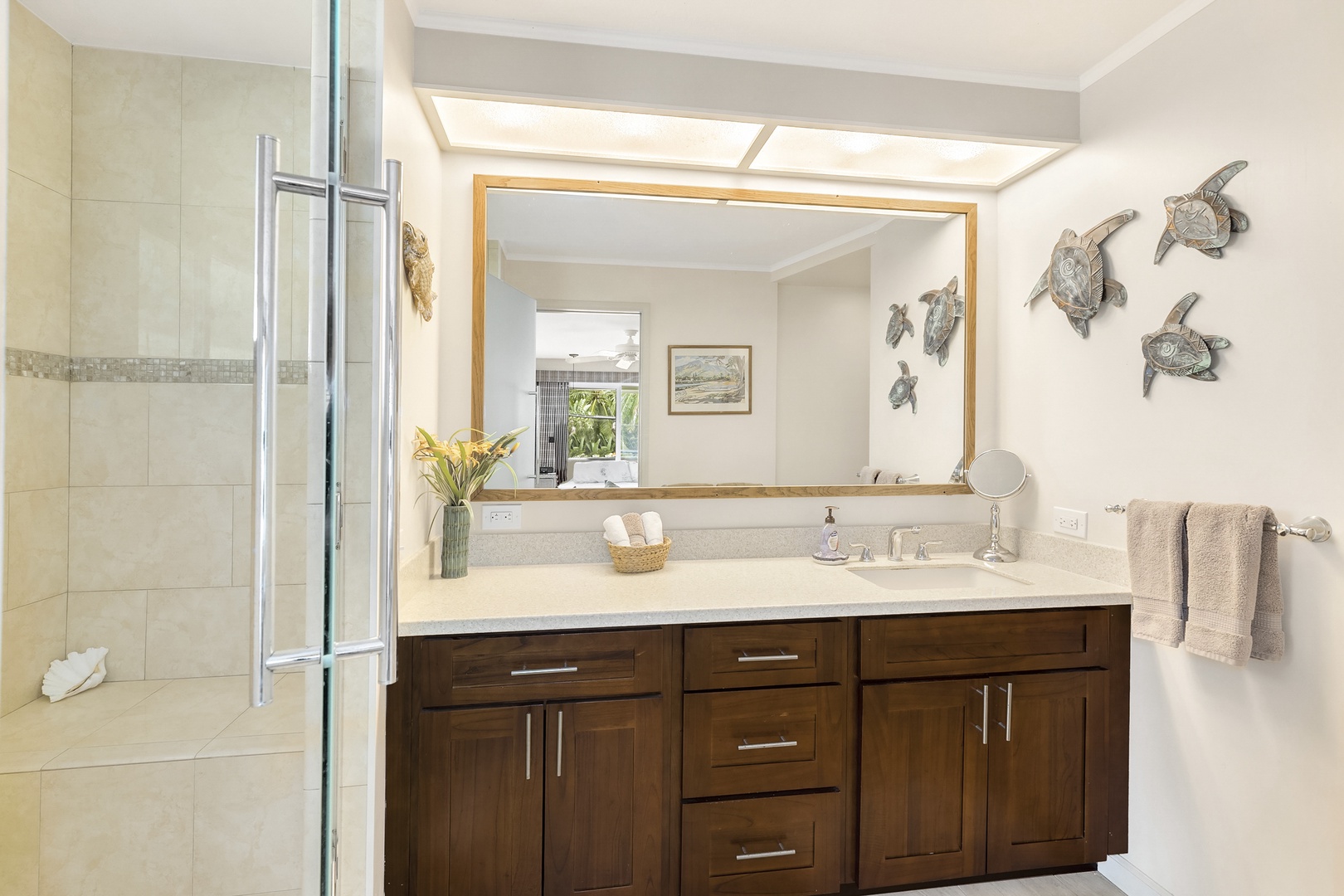 Haleiwa Vacation Rentals, Hale Kimo - Ensuite bathroom has a stand-up shower and plenty of storage.