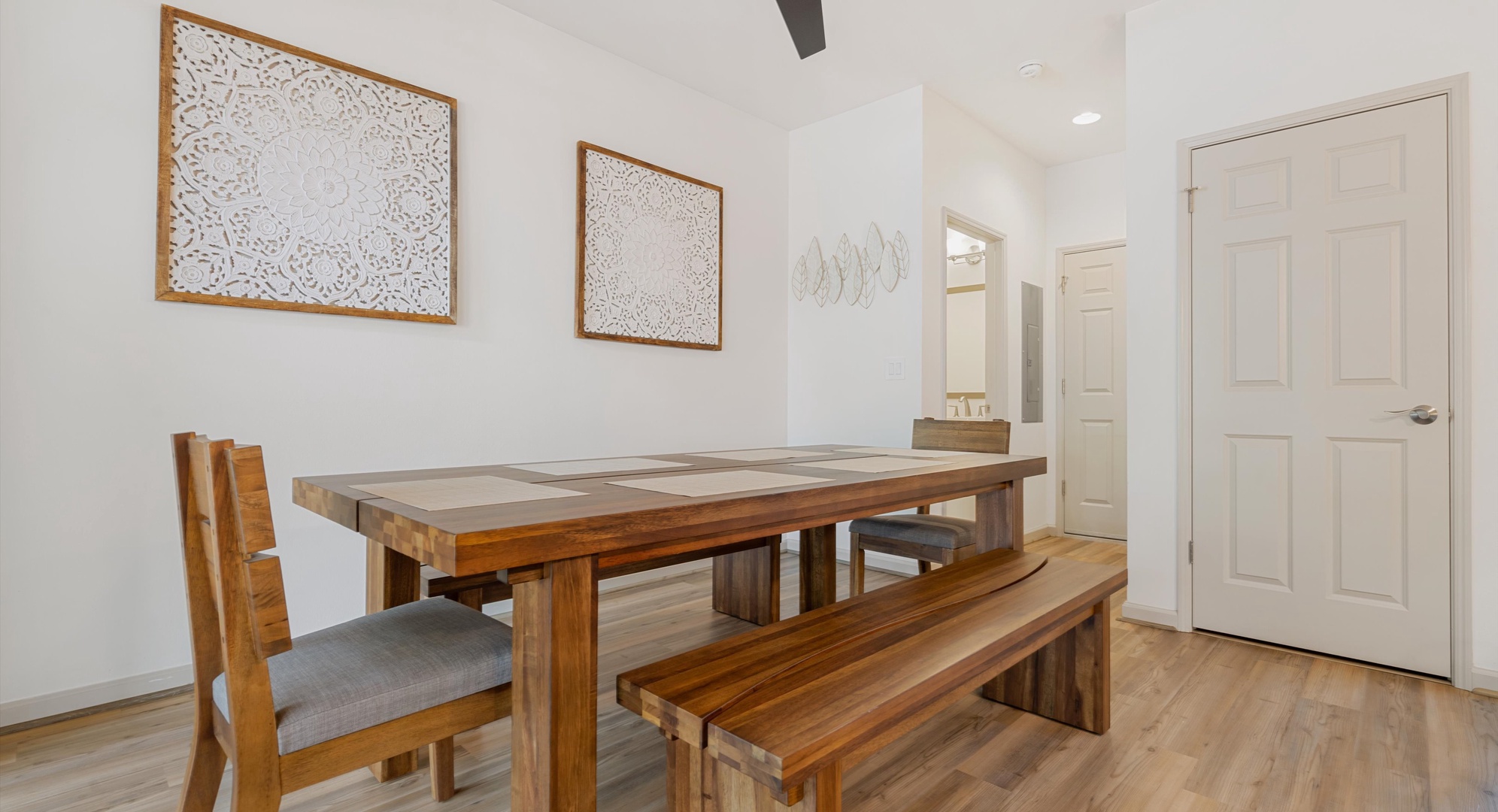 Makaha Valley Vacation Rentals, Makaha Valley Hale Kai** - Open dining space with bench seating, designed for easy gathering and conversation.