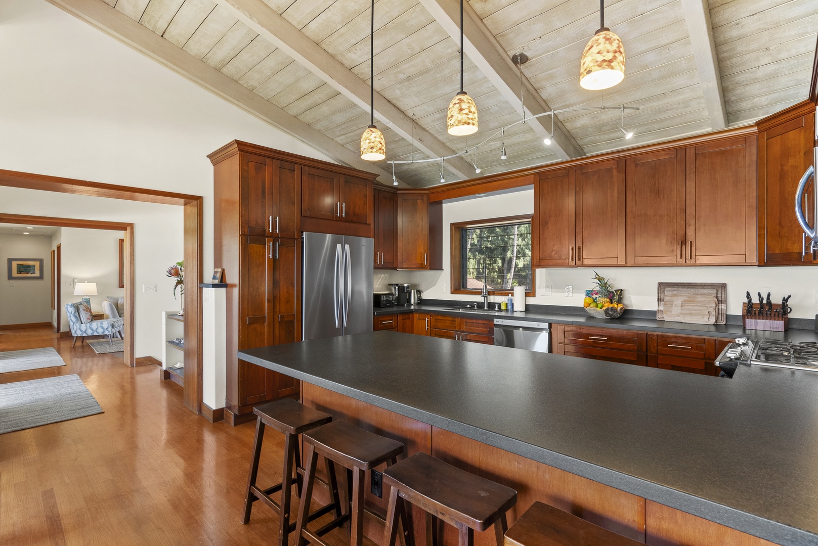 Haleiwa Vacation Rentals, Maluhia Beach House - A spacious kitchen with modern appliances and a large island for easy meal prep.