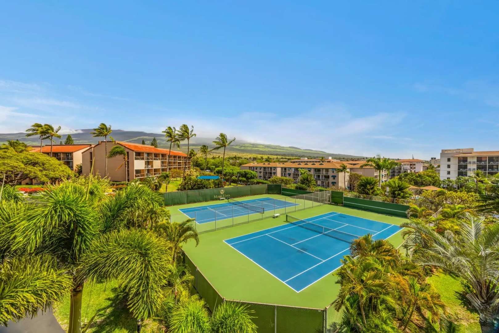 Kihei Vacation Rentals, Maui Vista 2420 - Courts tucked among the palms downstairs make for an easy match before the beach.