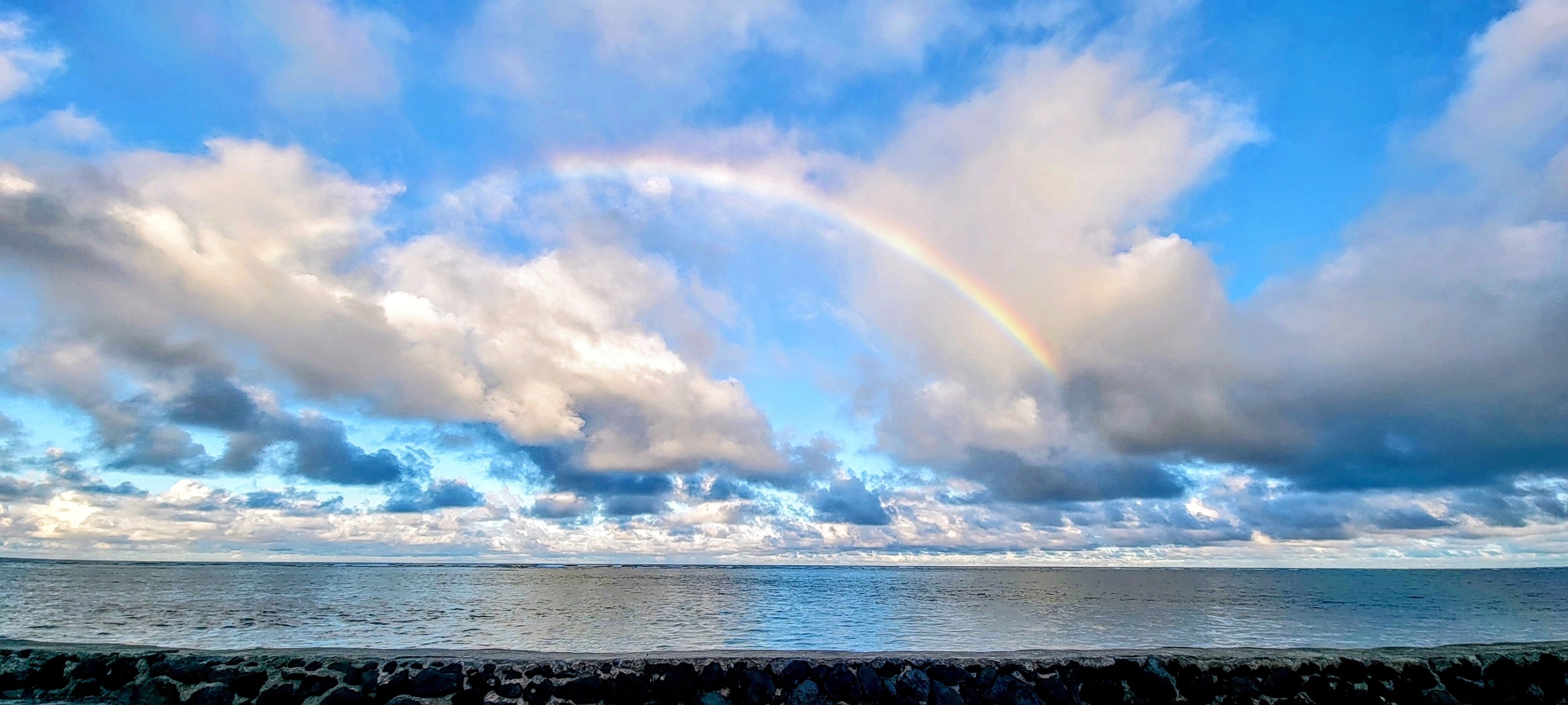 Hauula Vacation Rentals, Private Beach Paradise - A rainbow over the water, the kind that shows up between island showers.