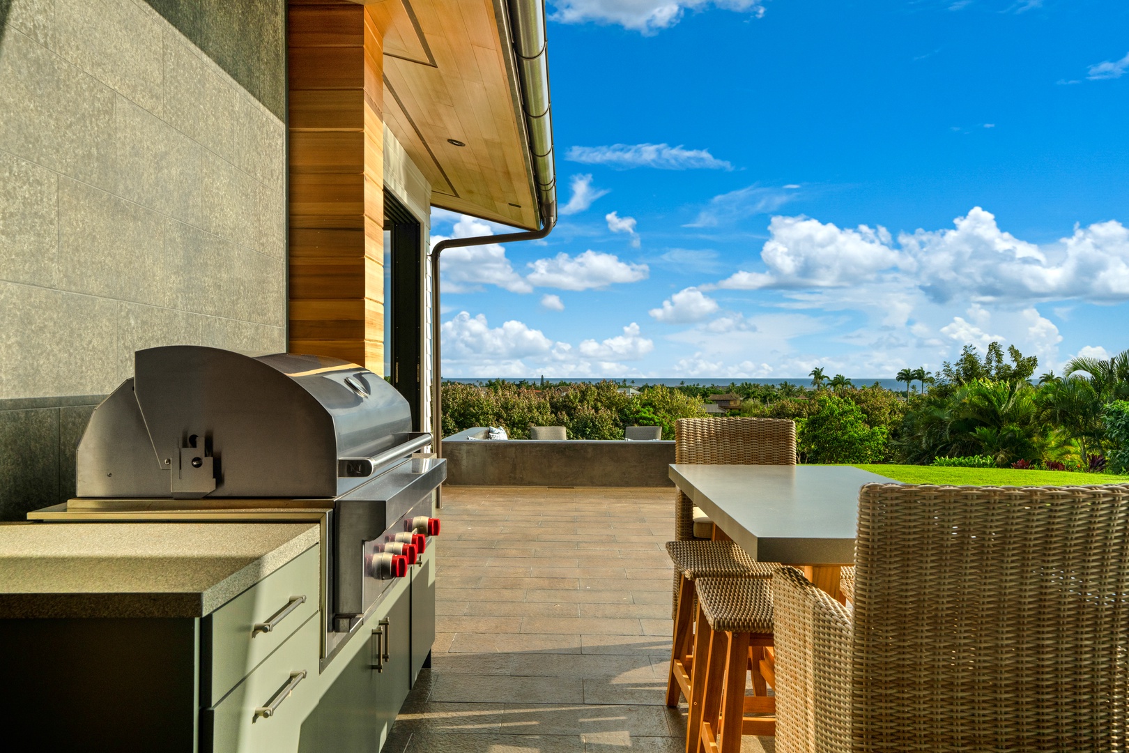 Koloa Vacation Rentals, Hale Laule'a at Kukui'ula - Grill your favorite meals while enjoying tropical views from this stunning outdoor kitchen and dining space.