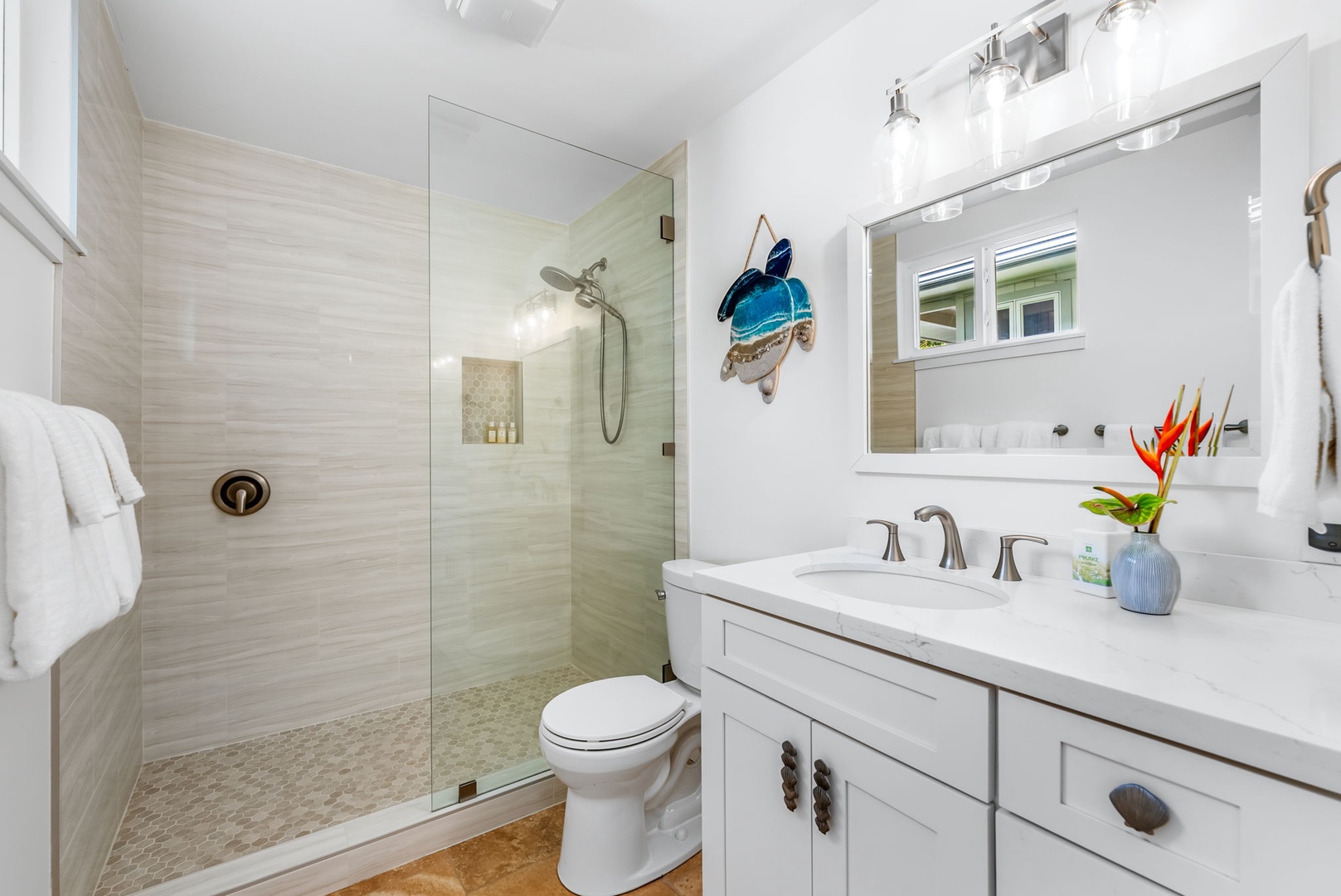 Kailua Vacation Rentals, Nohie Lanikai - A beautifully designed bathroom featuring a walk-in shower and natural light.