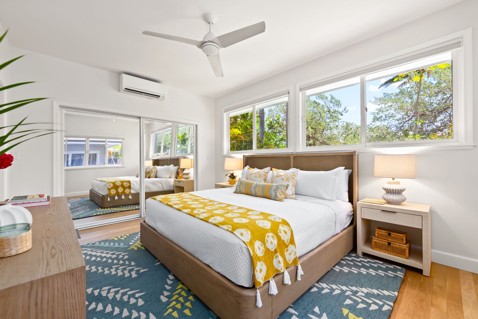 Kailua Vacation Rentals, Kailua Beach House - Cozy guest room with soft bedding, ceiling fan, and peaceful tropical light.