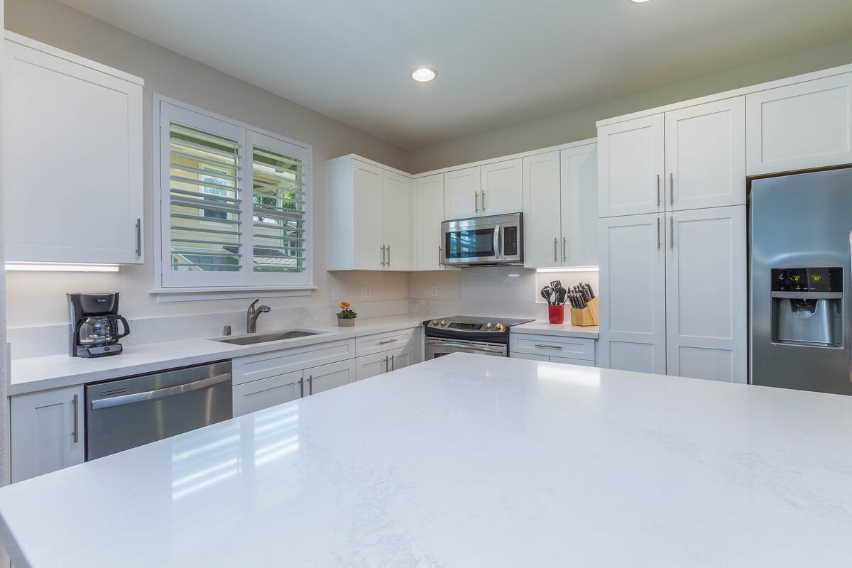 Princeville Vacation Rentals, Leilani Villa - Kitchen has quartz countertops and stainless steel appliances