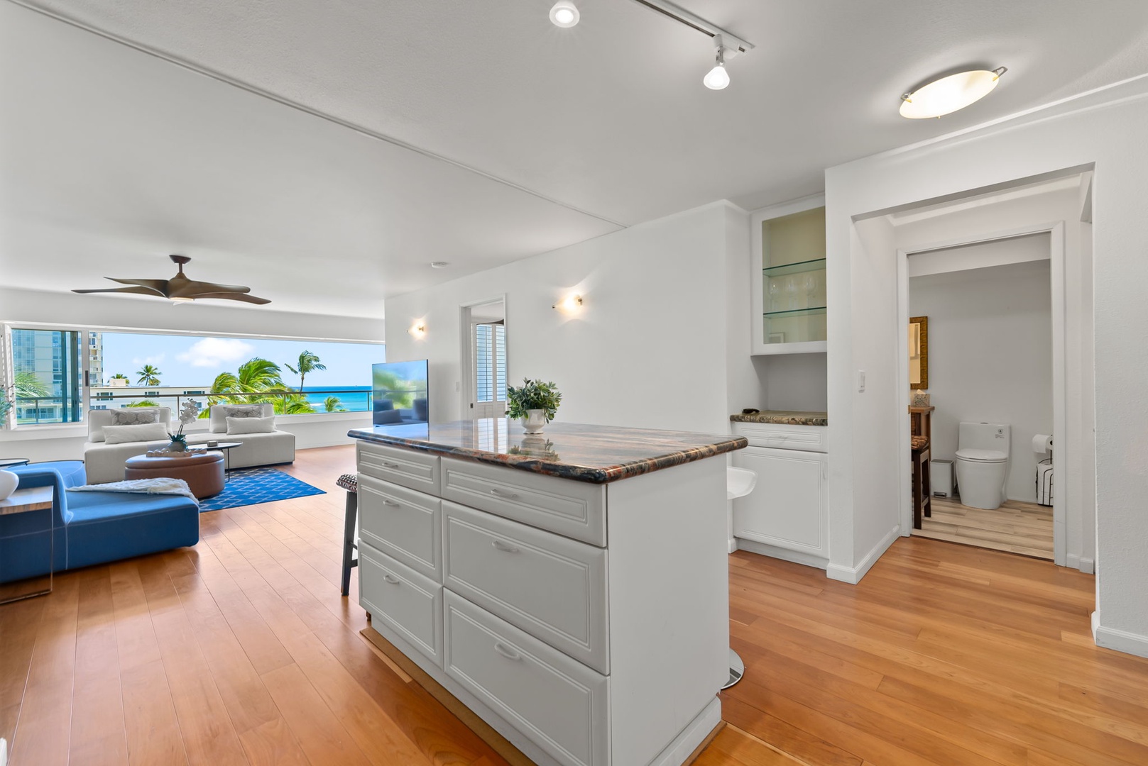 Honolulu Vacation Rentals, Colony Surf Retreat - The kitchen’s open layout lets you cook while soaking in the views—perfect for social cooking or entertaining.