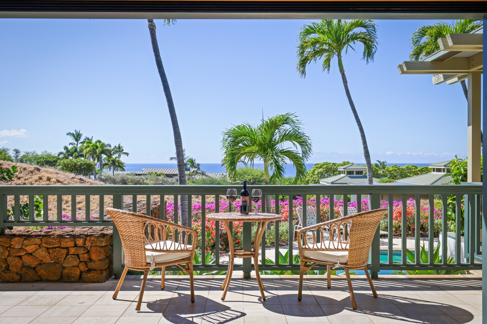 Kamuela Vacation Rentals, 4BD Fairways South Estate (29) at Mauna Kea Resort - Take a step out of the primary bedroom to enjoy this cheerful seating for two, which overlooks the pool and spa
