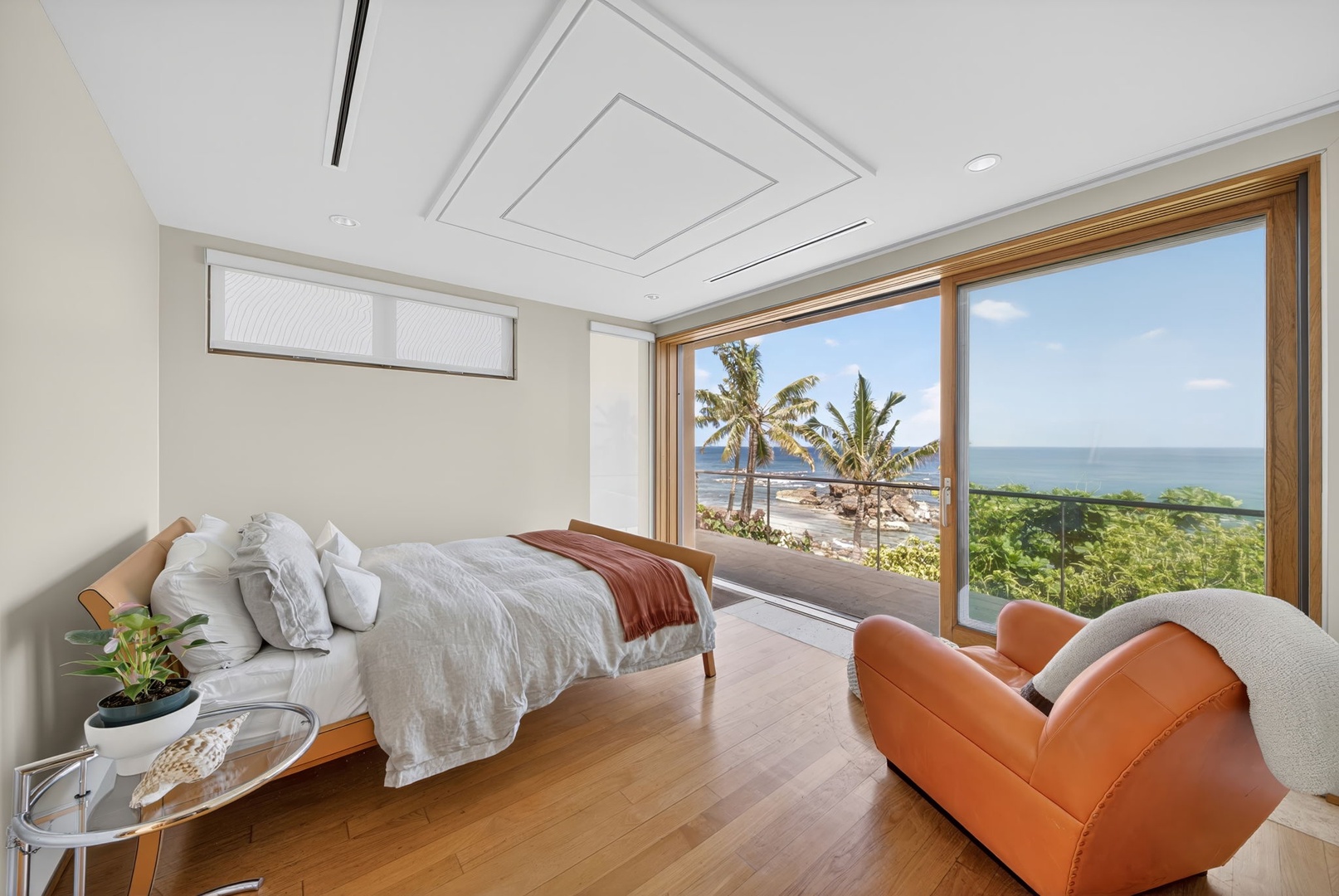 Haleiwa Vacation Rentals, HaleGator - Wake to breathtaking ocean views from this bright guest suite, where floor-to-ceiling glass invites the coastline indoors.