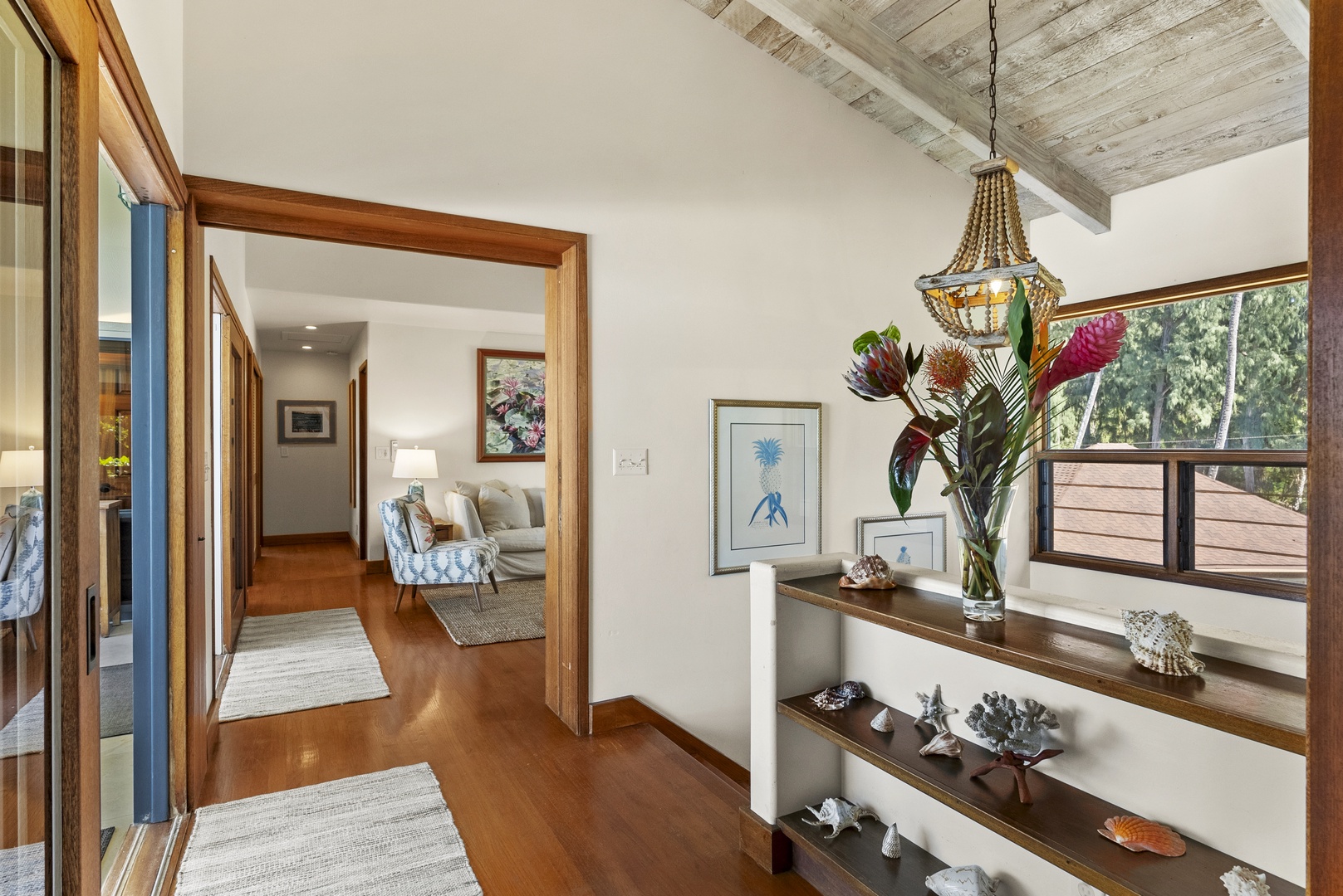 Haleiwa Vacation Rentals, Maluhia Beach House - A bright and airy hallway leading to beautifully designed living spaces with ocean-inspired décor.