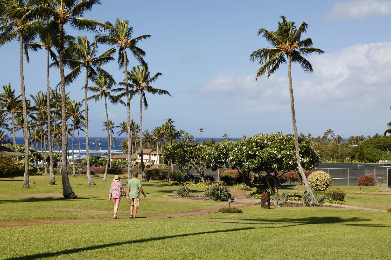 Koloa Vacation Rentals, Pili Mai 14K - Tropical oasis with lush greenery.