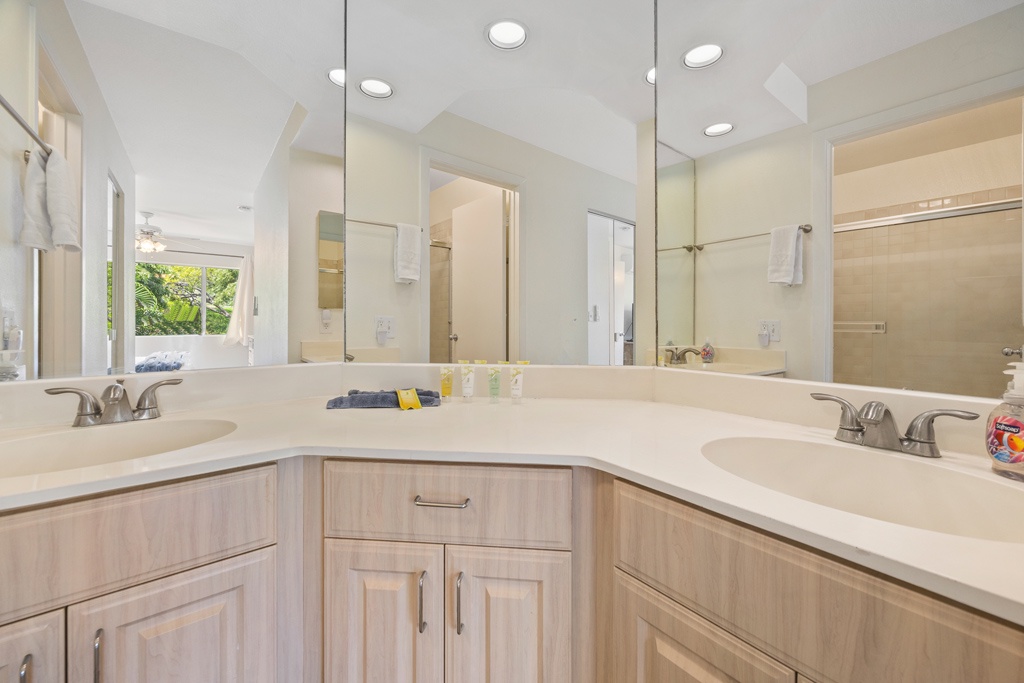 Upstairs primary bathroom with dual sinks and generous counter space for easy mornings.