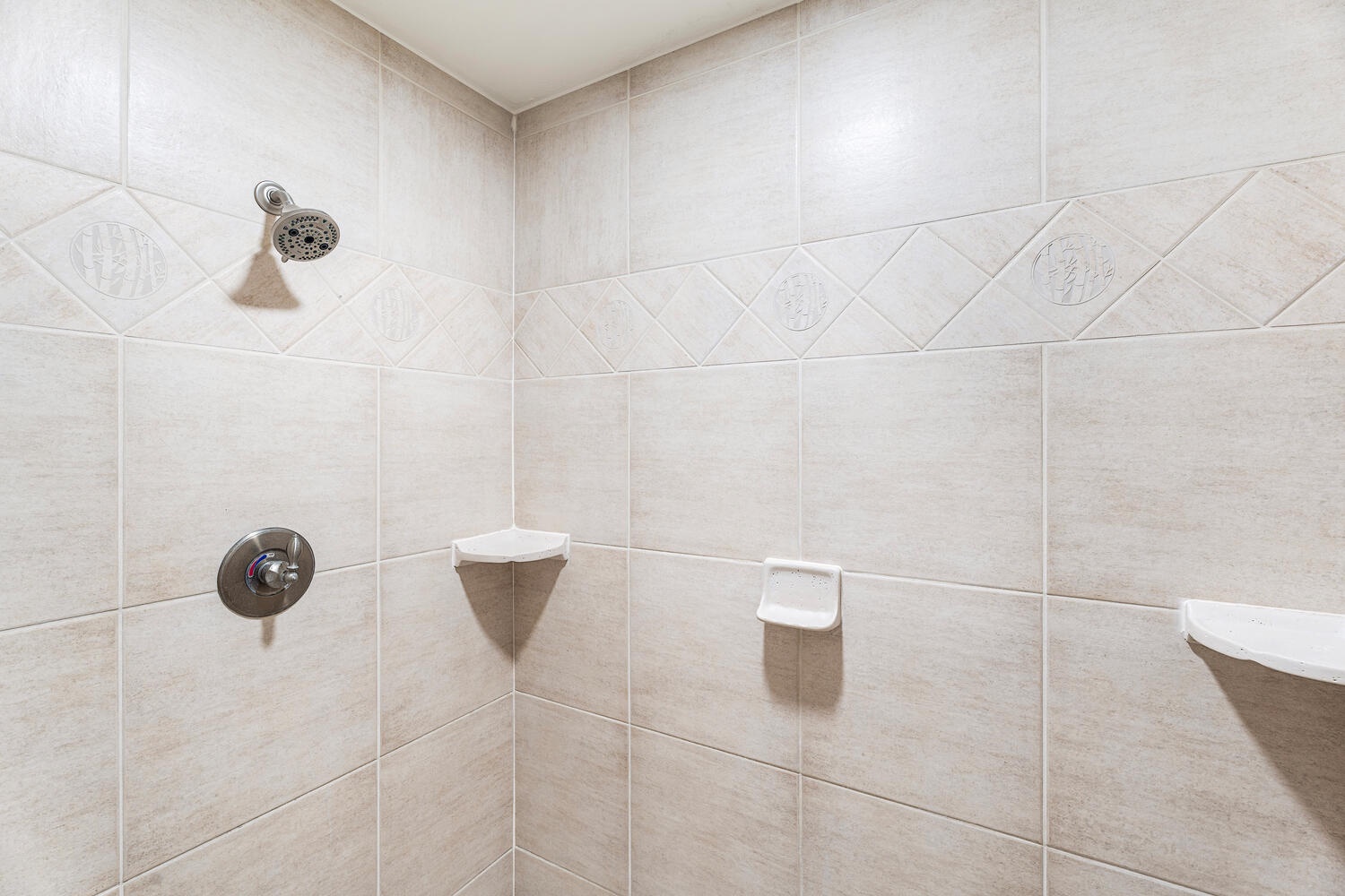 Kailua Kona Vacation Rentals, Kanaloa at Kona 3304 - Spacious walk-in shower with tile surround in the primary ensuite.