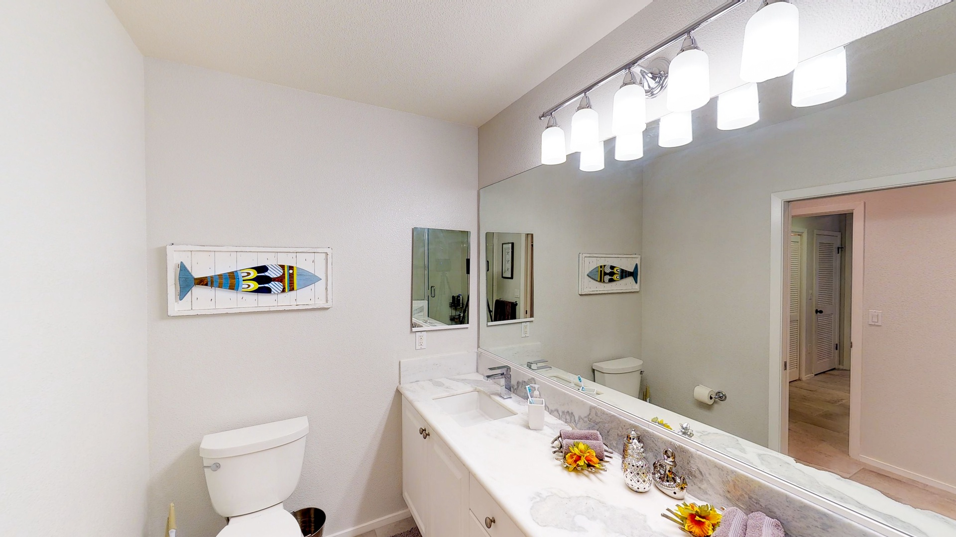 Kapolei Vacation Rentals, Coconut Plantation 1222-3 - The primary guest bathroom with a long vanity and ample lighting.