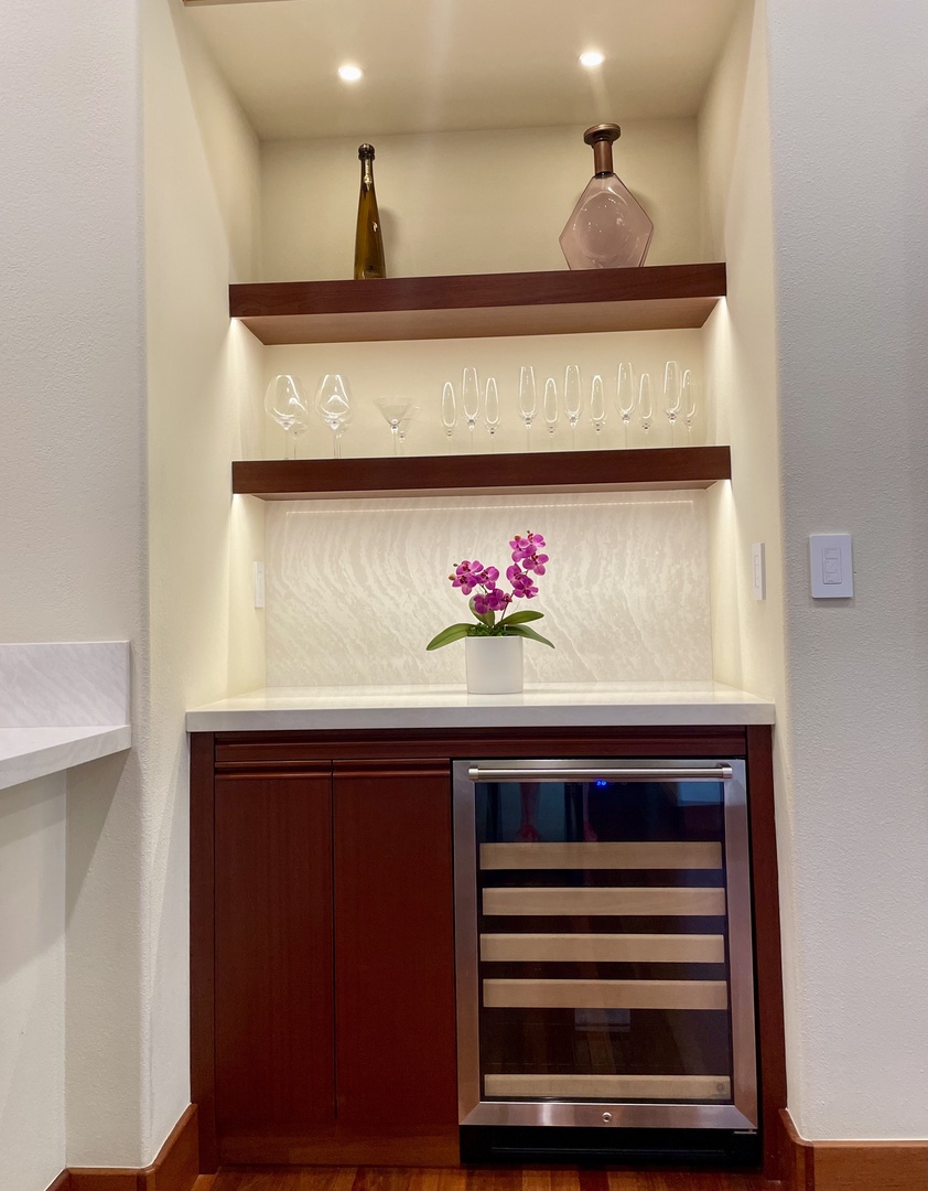 Kamuela Vacation Rentals, Champion Ridge Oasis - Elegant wet bar with a wine fridge and glassware, ideal for entertaining or enjoying a quiet evening drink.