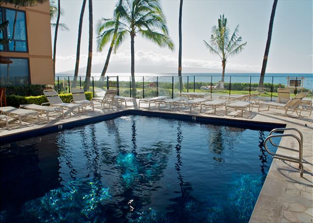 Lahaina Vacation Rentals, Mahana 718 - Take a refreshing dip in the pool while enjoying stunning ocean views in the background.