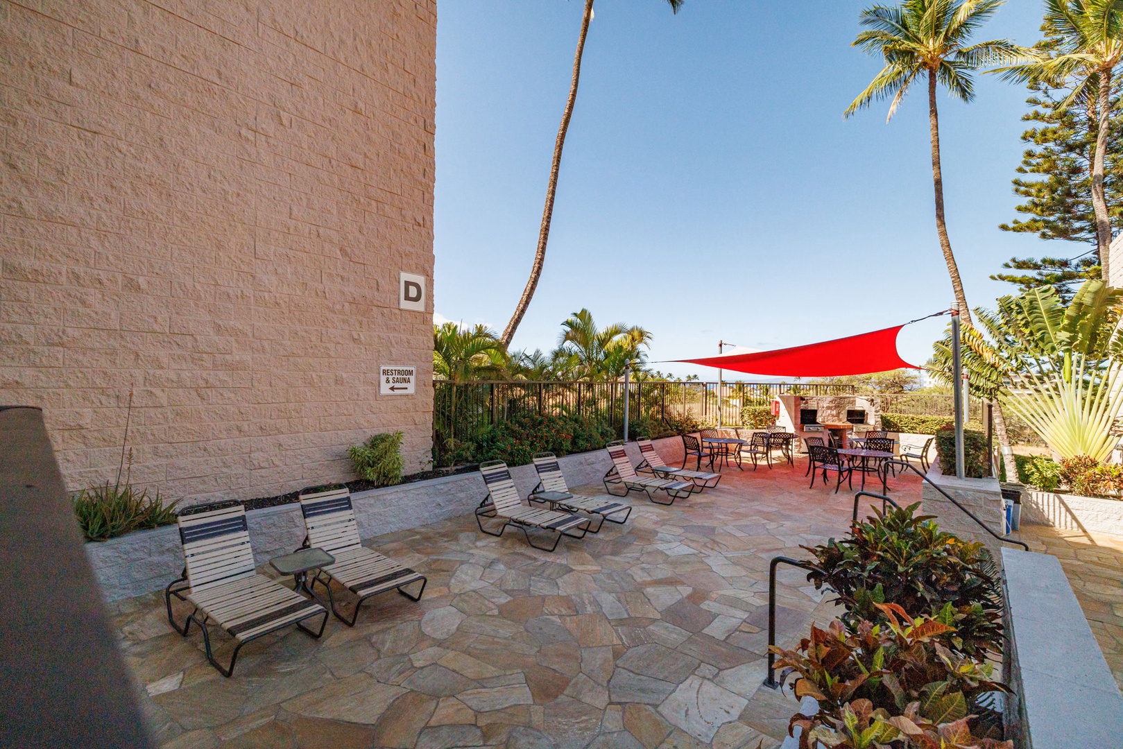 Kihei Vacation Rentals, Kihei Alii Kai C206 - Stretch out on a lounger under the shade sail while the afternoon goes slow.